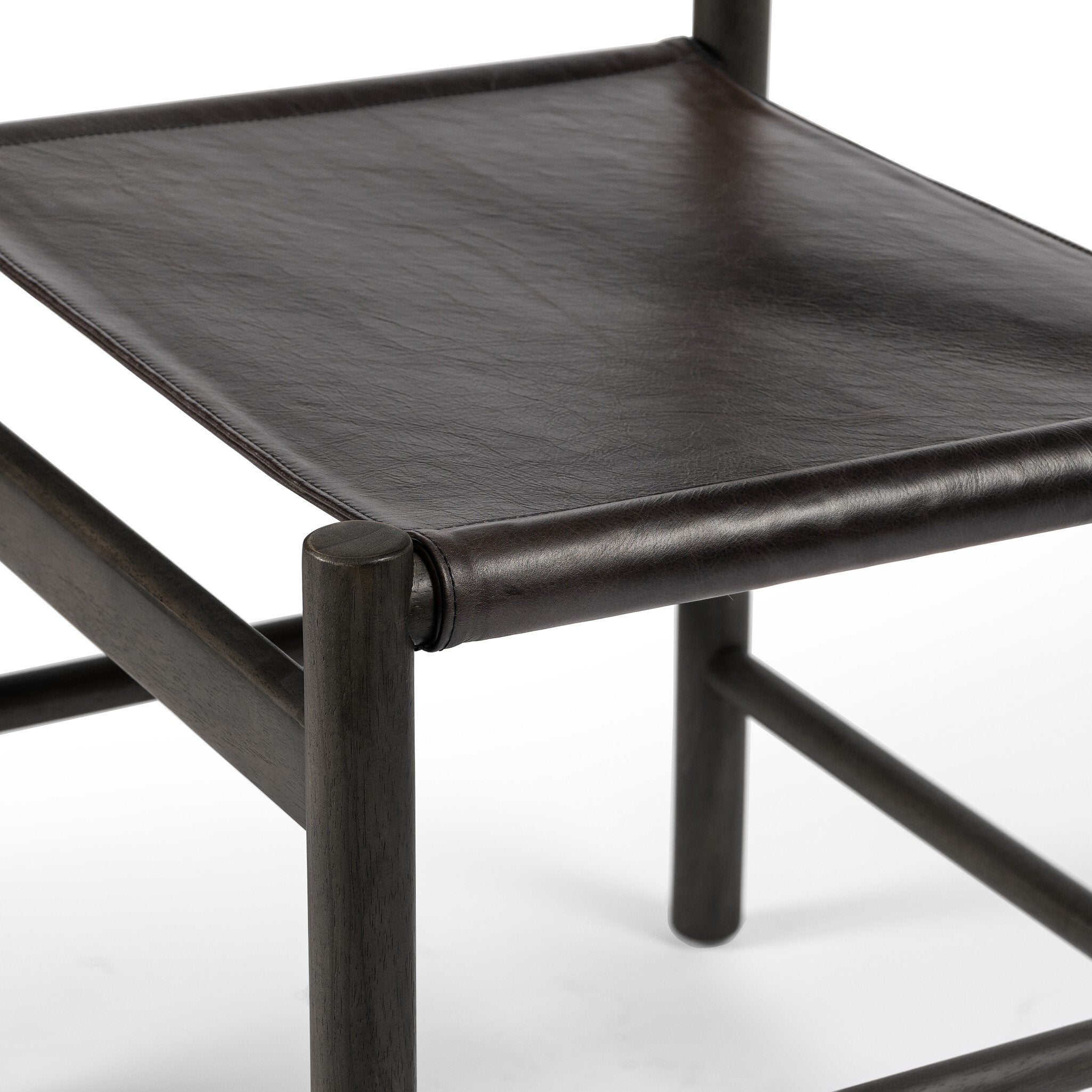Black leather chair seat on a white background
