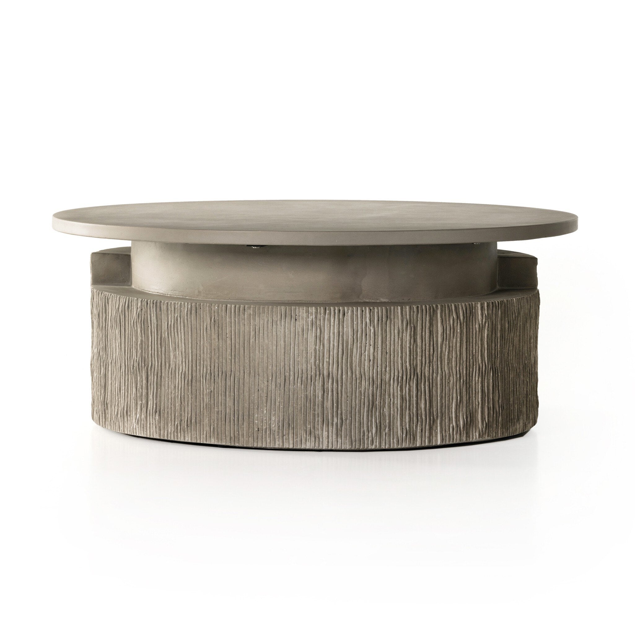Round coffee table with a light smooth concrete top and textured base on a white background