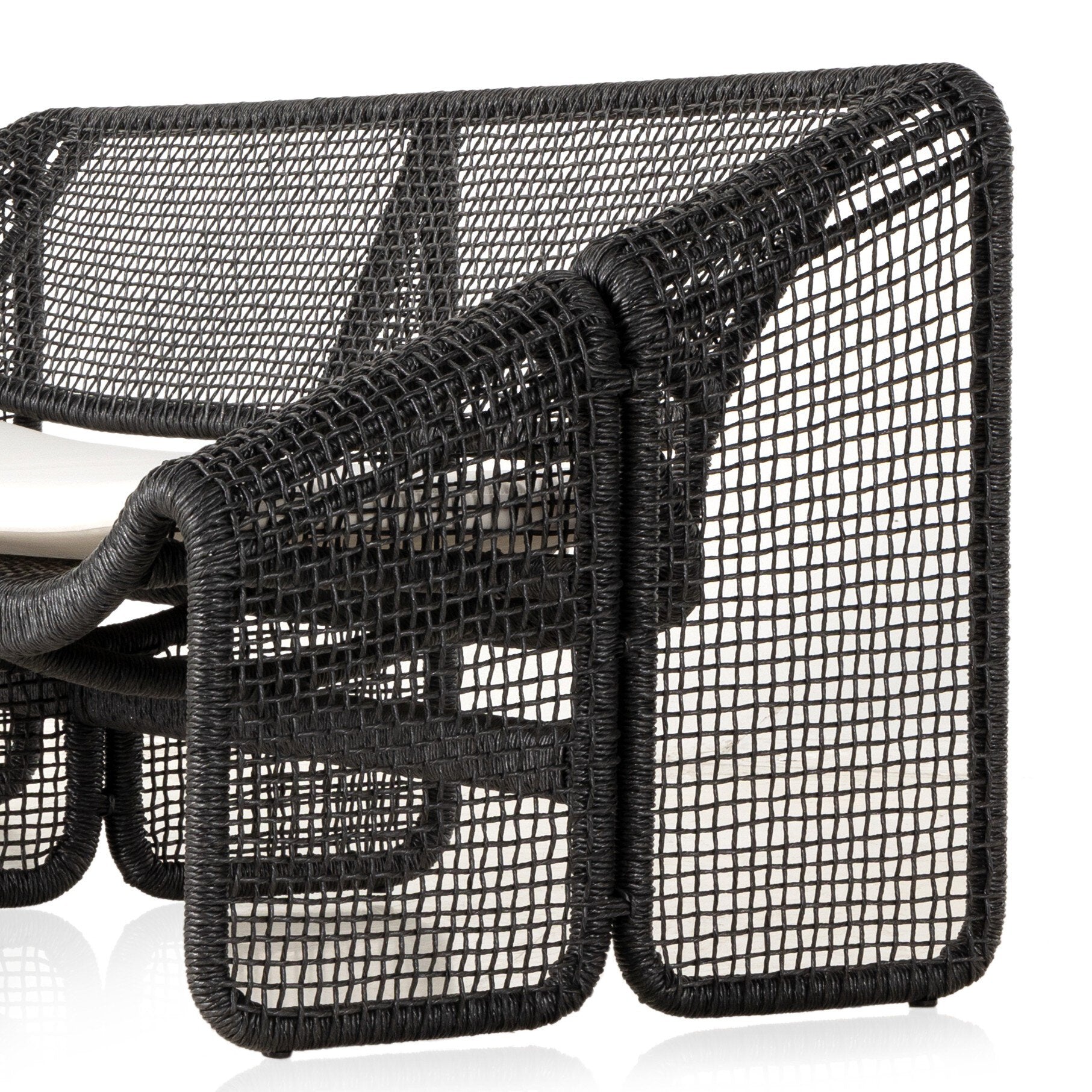 wicker black outdoor sofa with a beige seat cushion