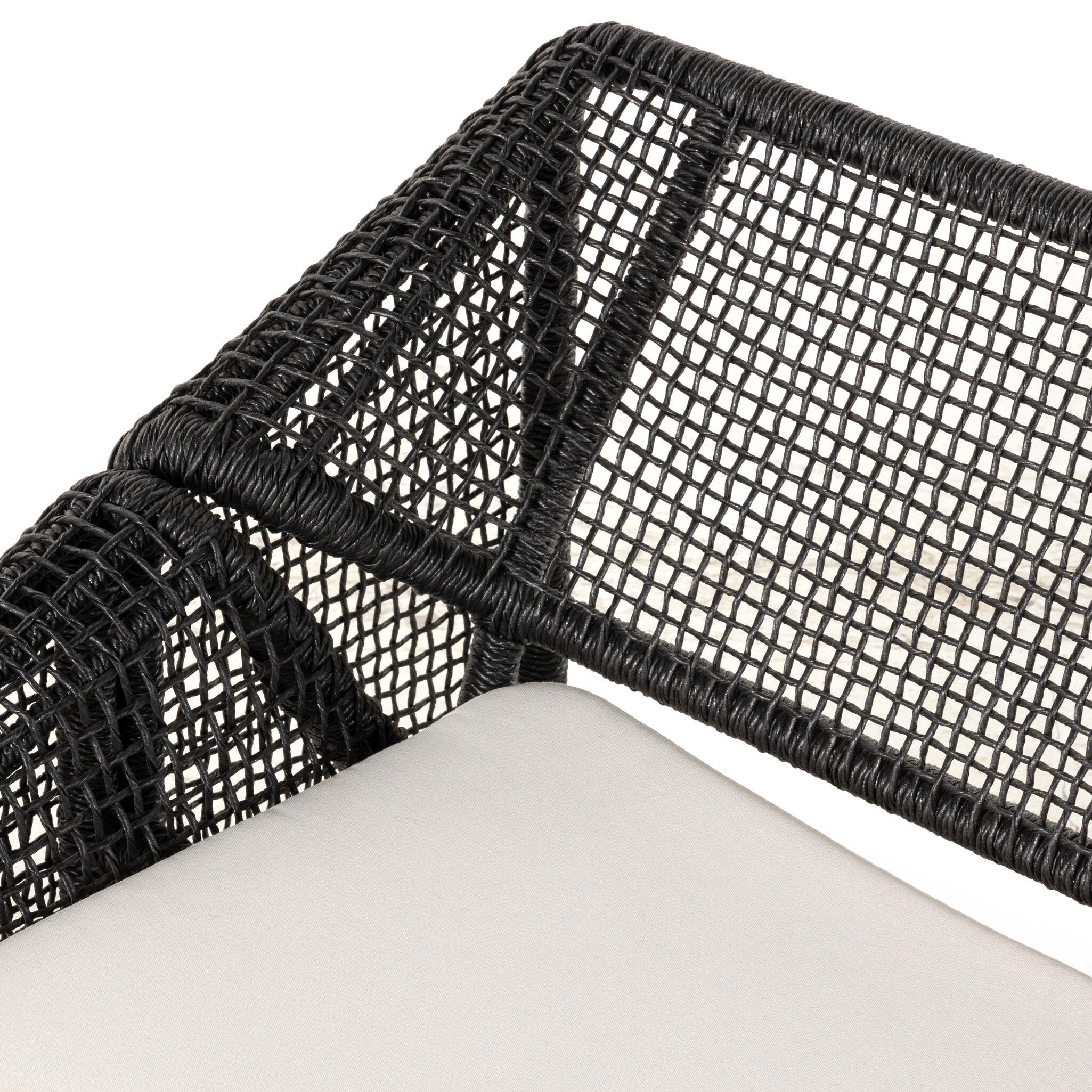 Close up detail up wicker outdoor sofa arm 