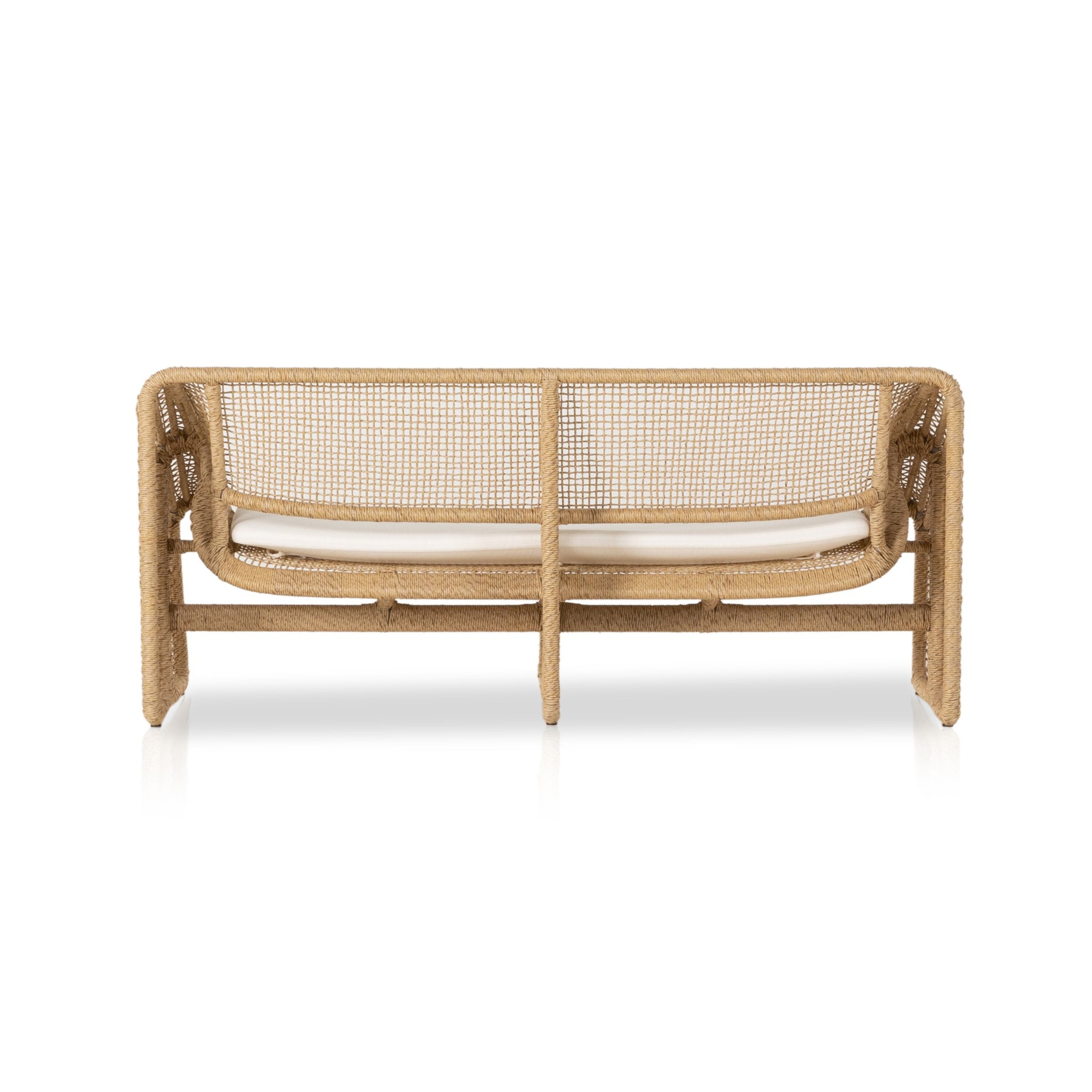 An outdoor sofa with a beige all-weather wicker frame and a white cushion.