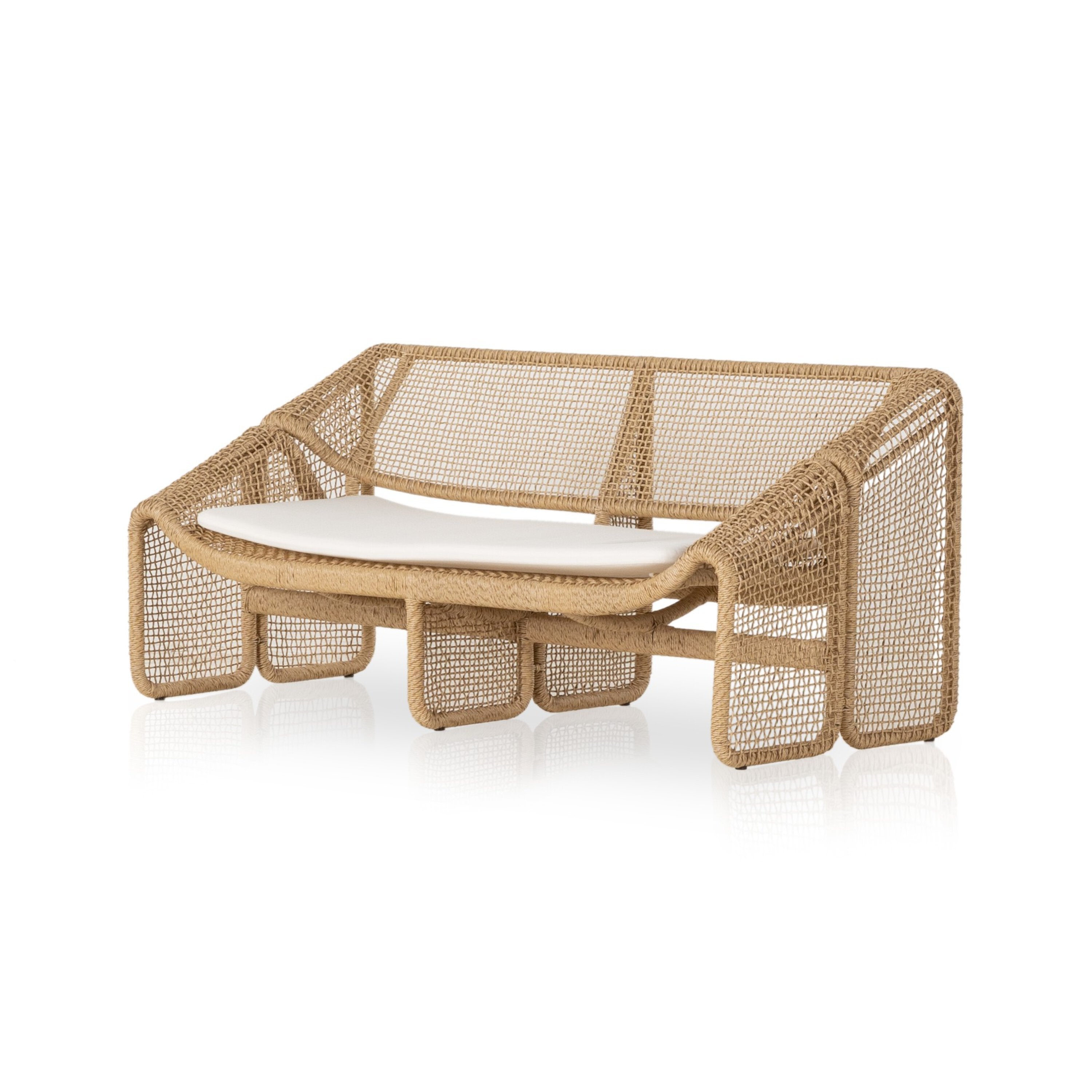 An outdoor sofa with a beige all-weather wicker frame and a white cushion.