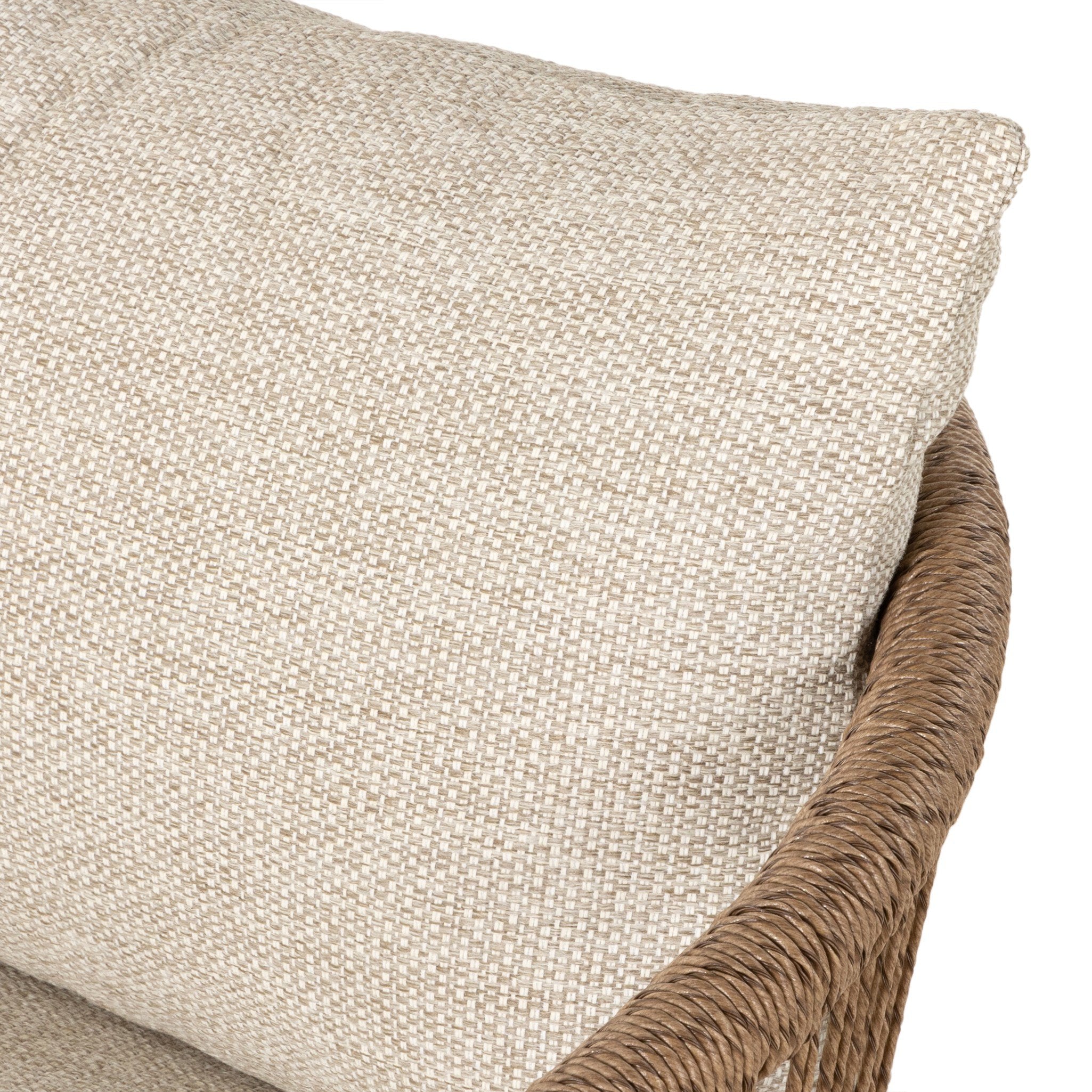 Textured beige pillow with woven brown rim on a white background