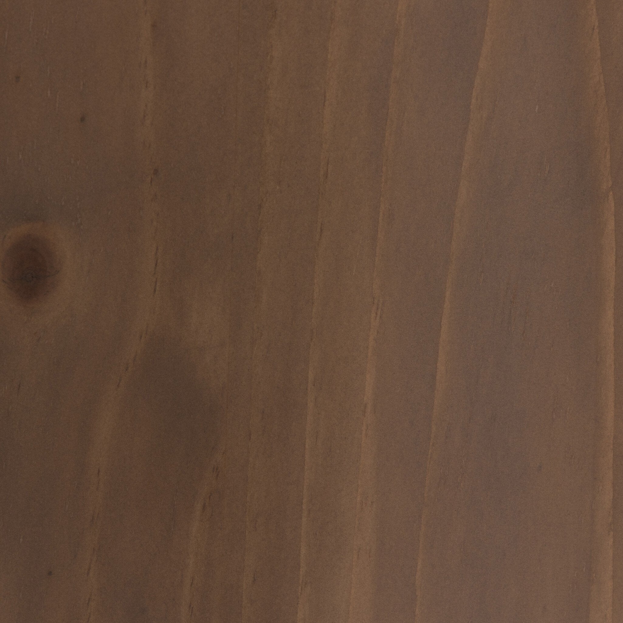 Close-up of a brown wooden surface with visible grain and texture
