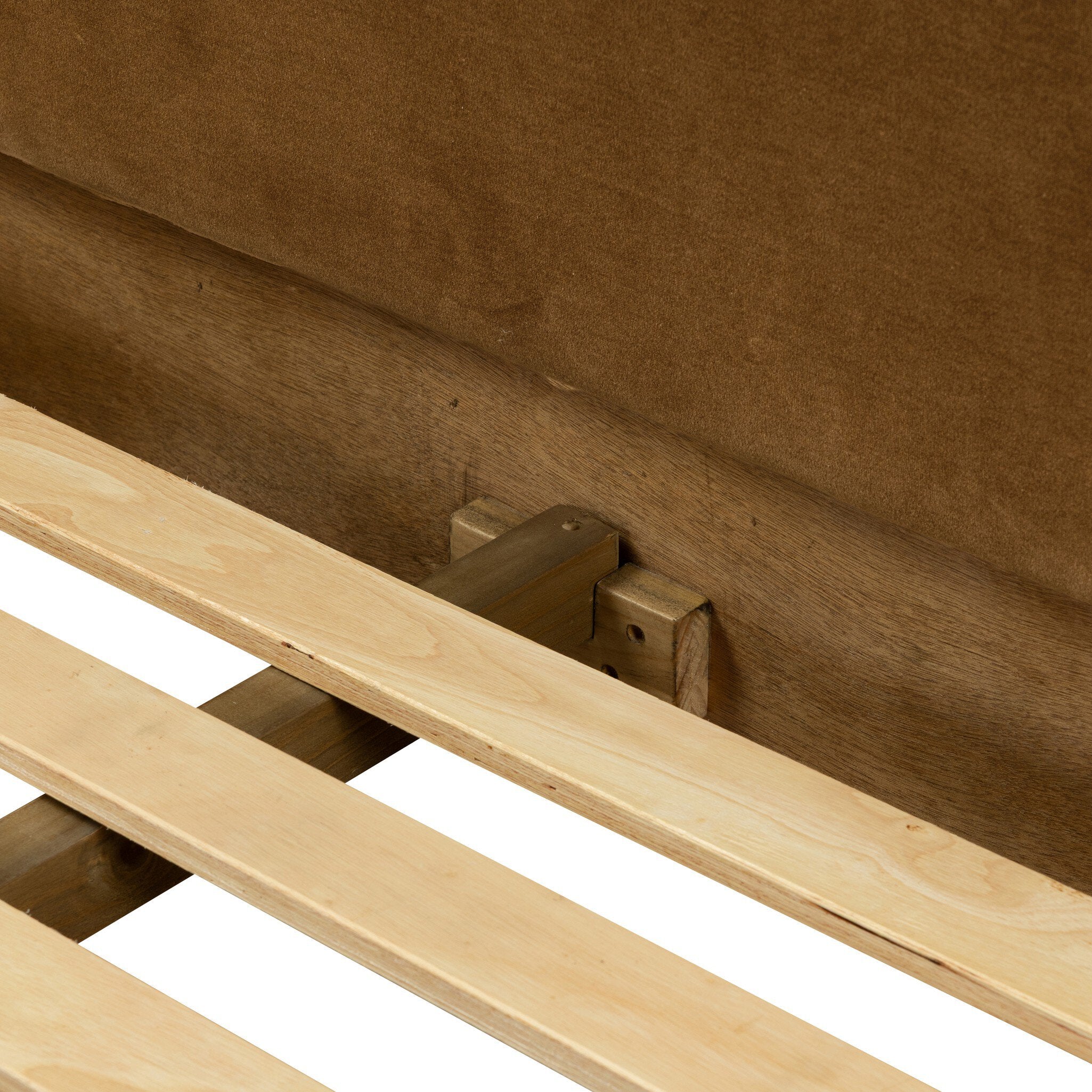 Wooden slats against a brown headboard