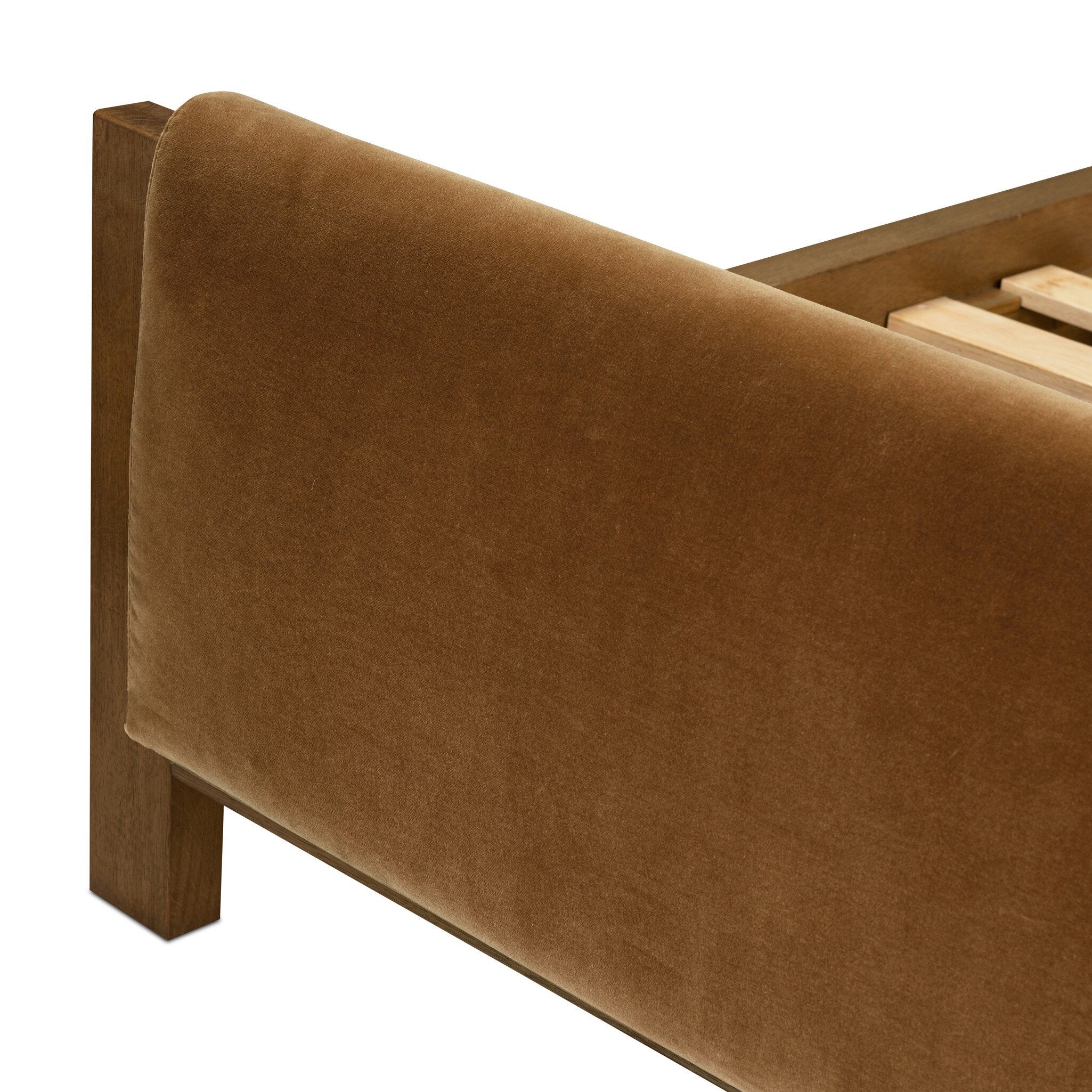 Brown upholstered footboard on a white background