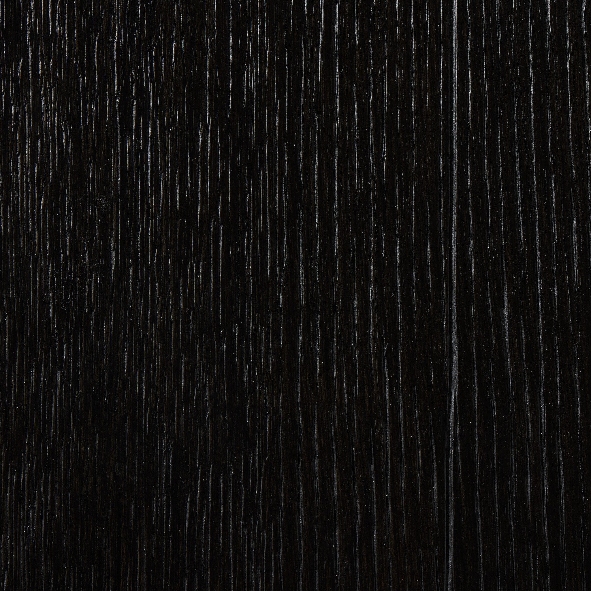 Close-up of a dark wooden surface with vertical grain pattern