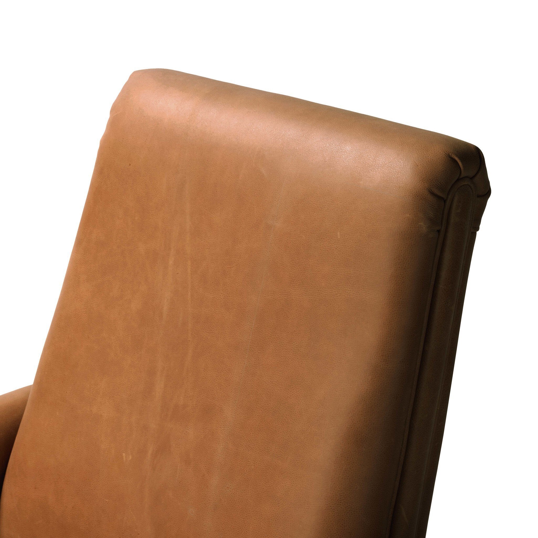 Close-up of a brown leather chair back on a white background