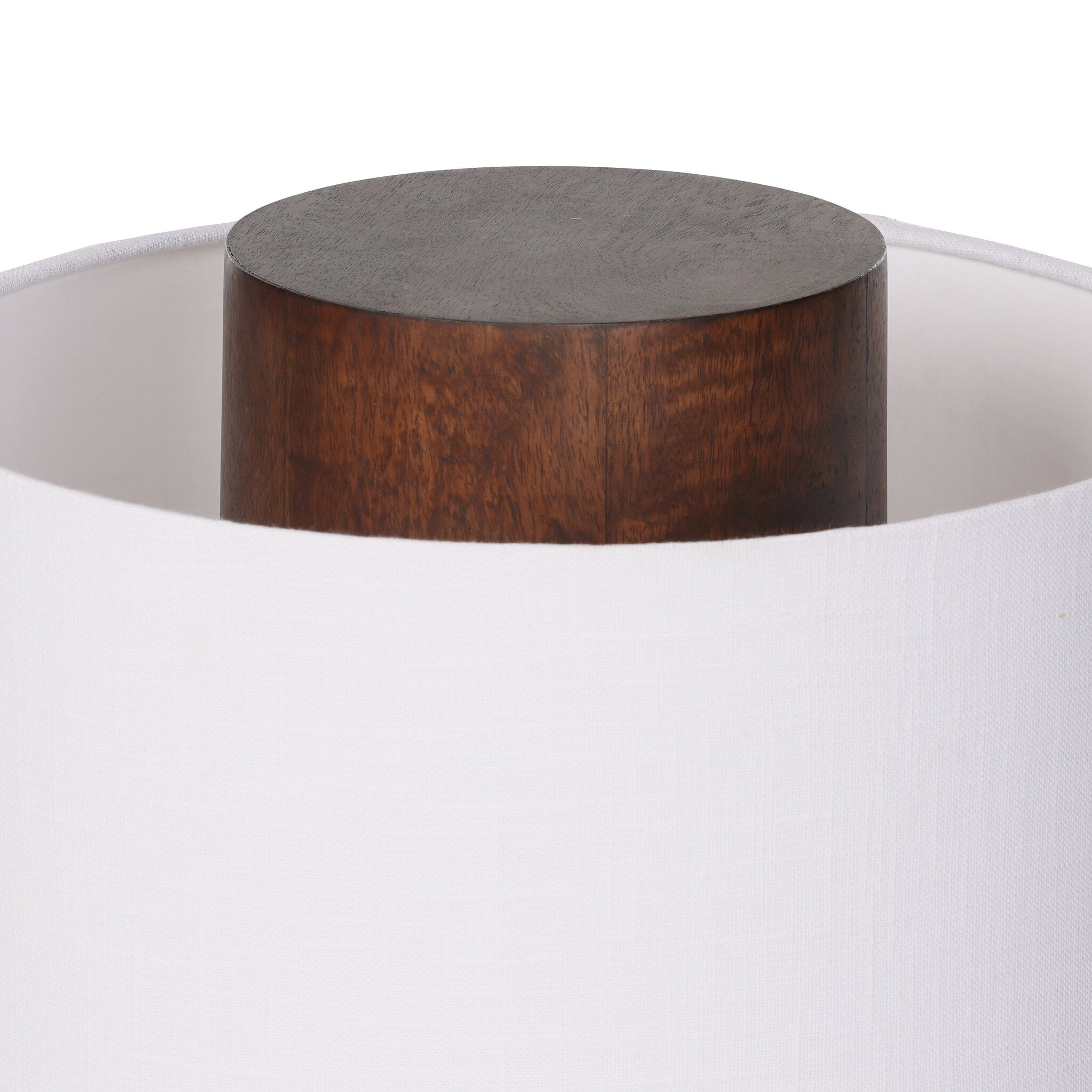 Wooden cylindrical table lamp with white lampshade on a white background