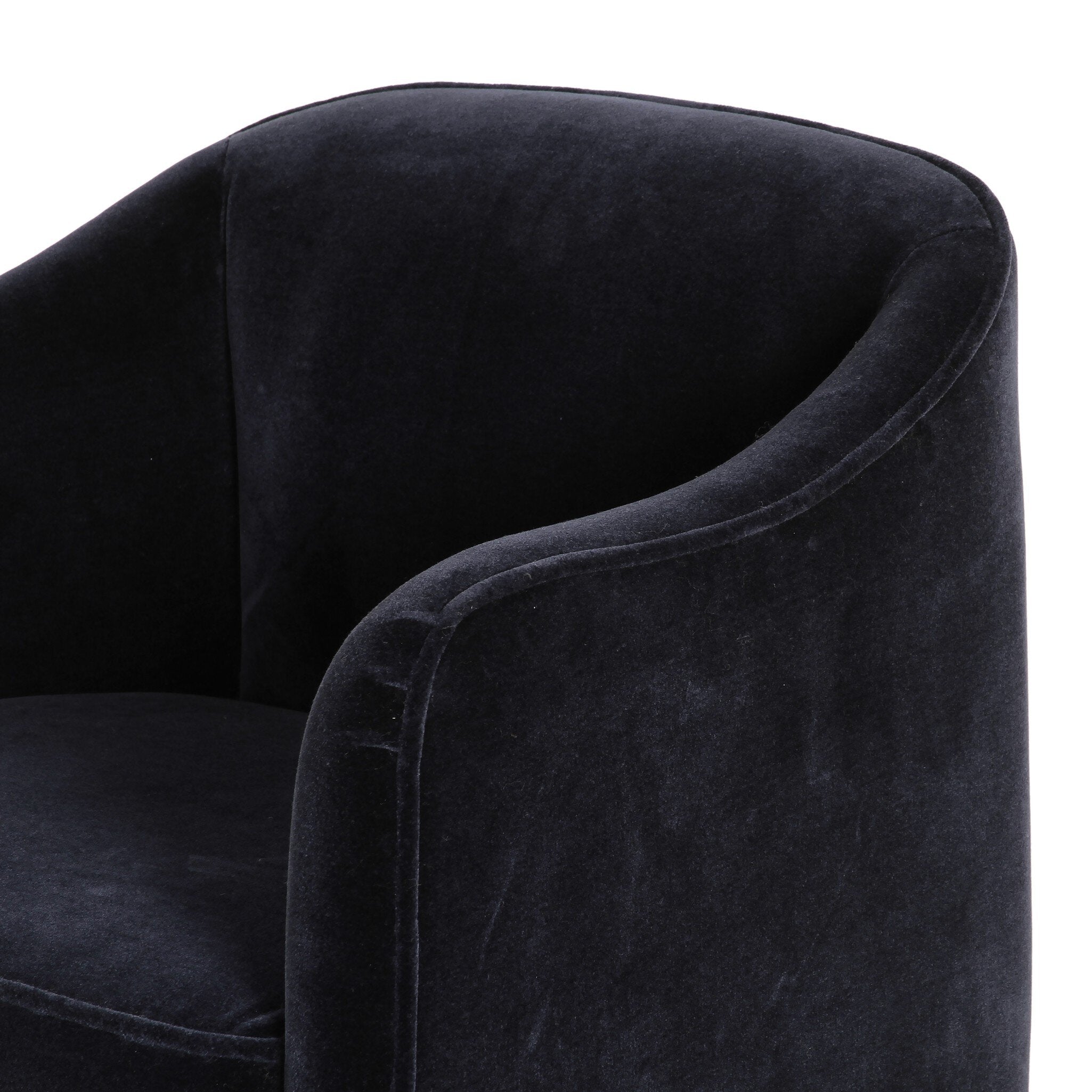 Dark gray velvet armchair on a white background