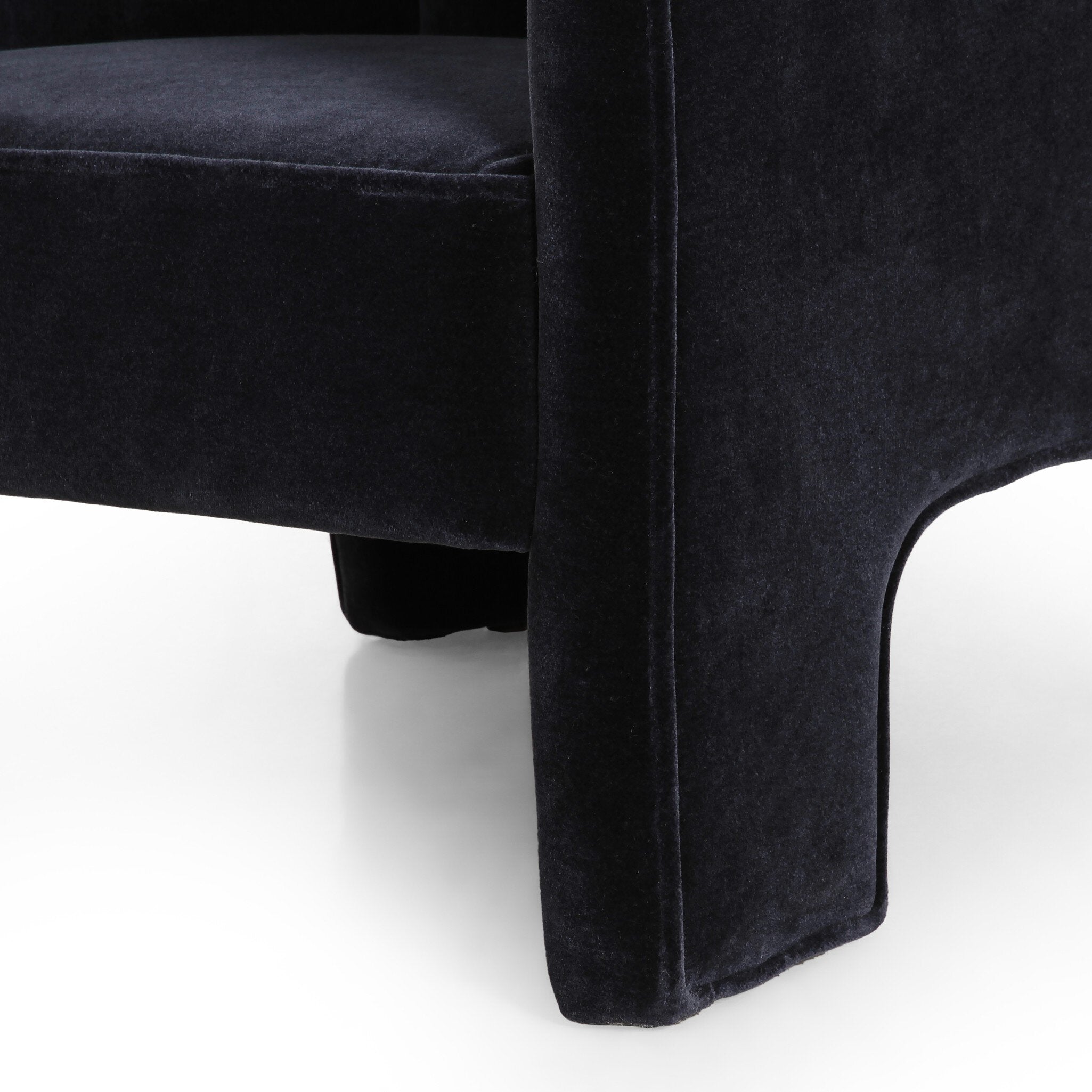 Close-up of a dark gray upholstered chair on a white background