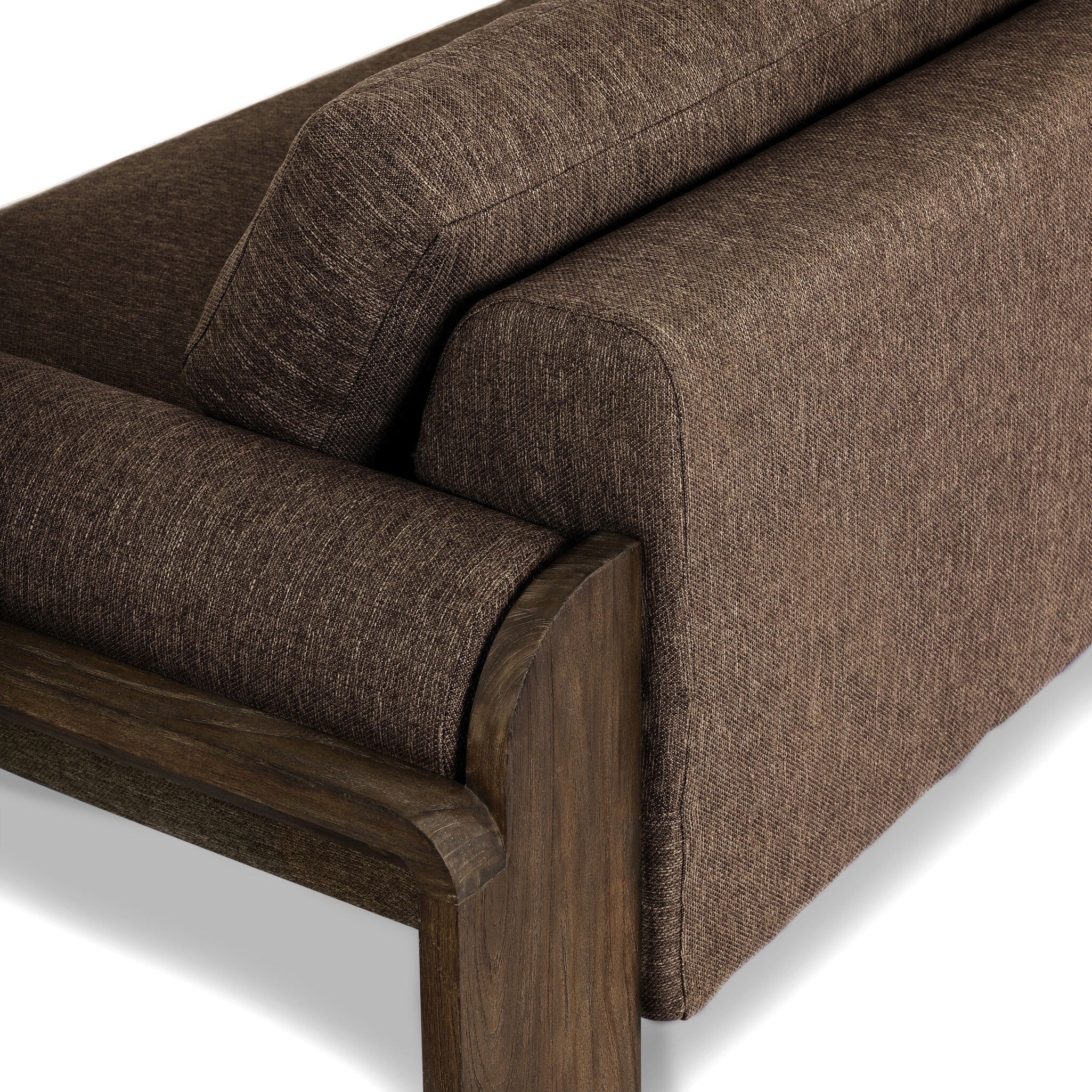 Brown fabric sofa with wooden armrests on a white background