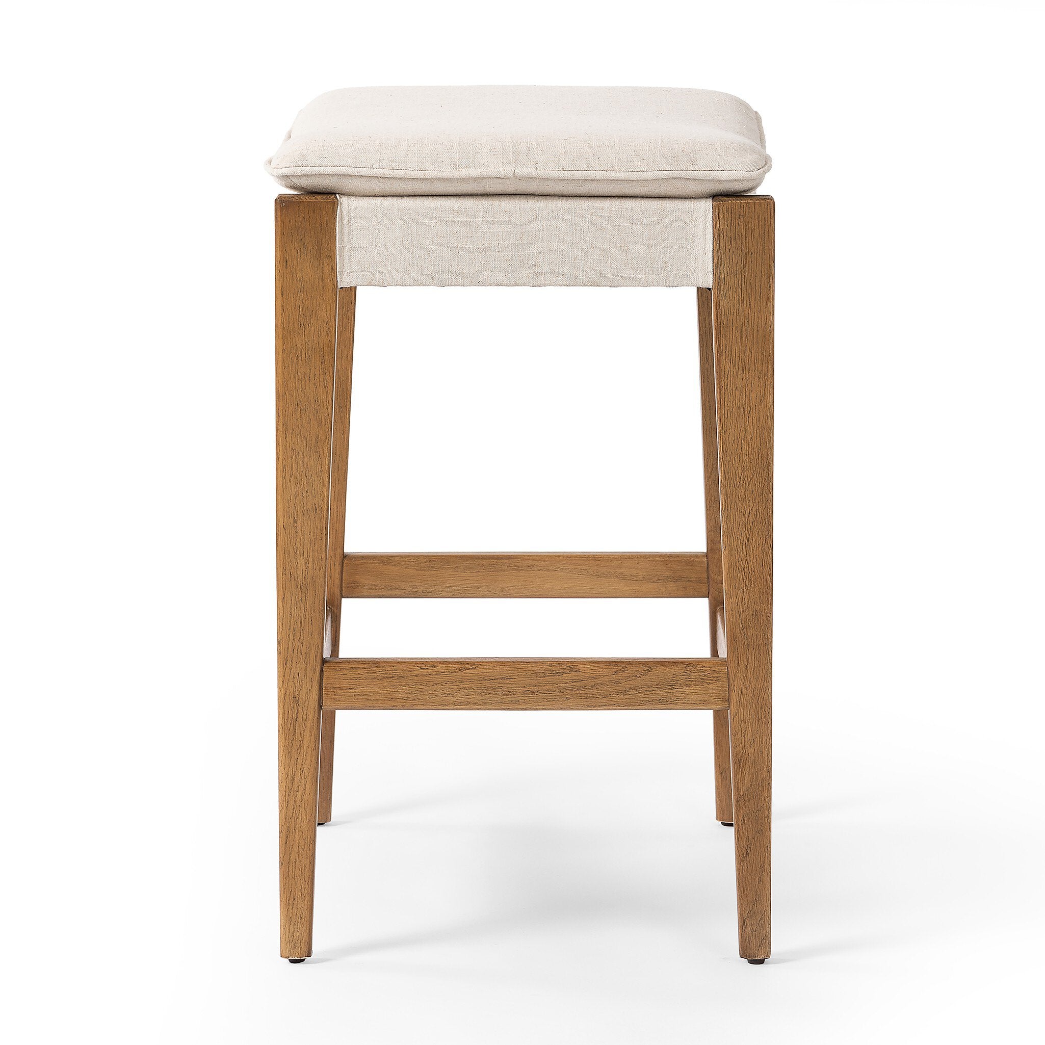 Wooden bar stool with a beige cushioned seat on a white background