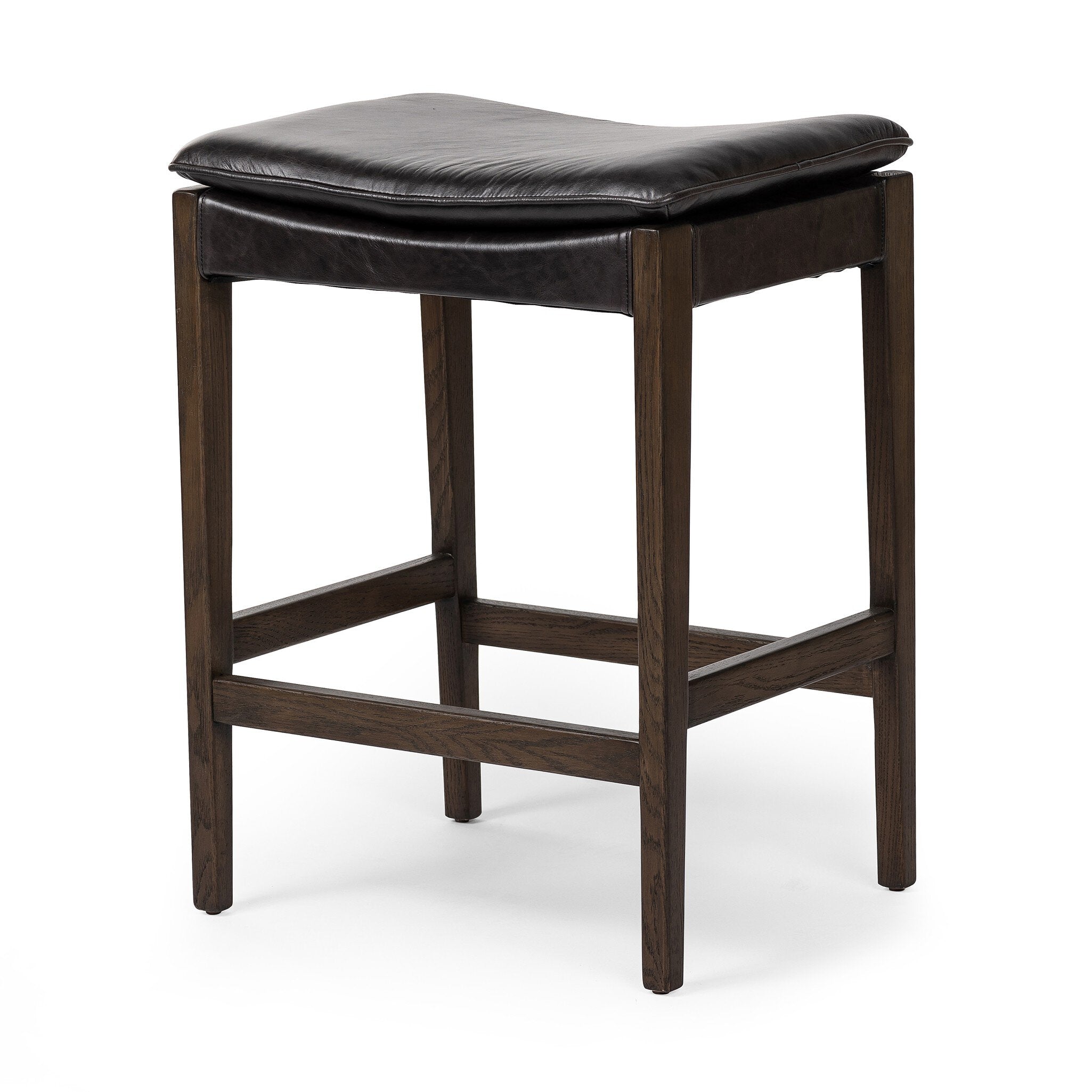 Wooden stool with black leather seat on a white background