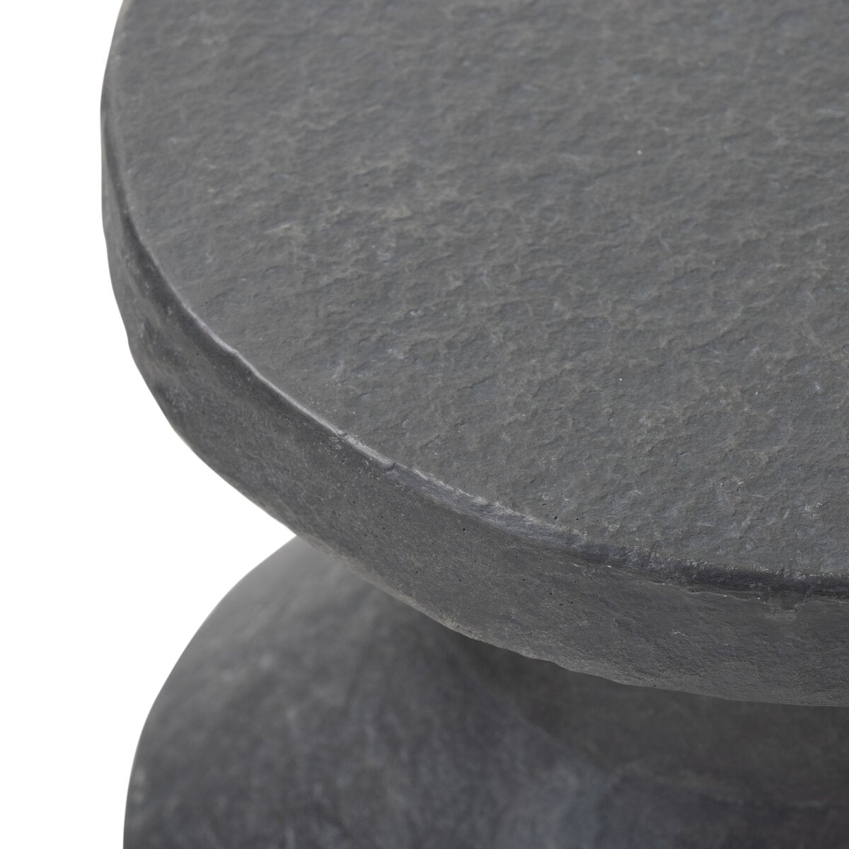 Close-up of a dark gray stone table with a white background