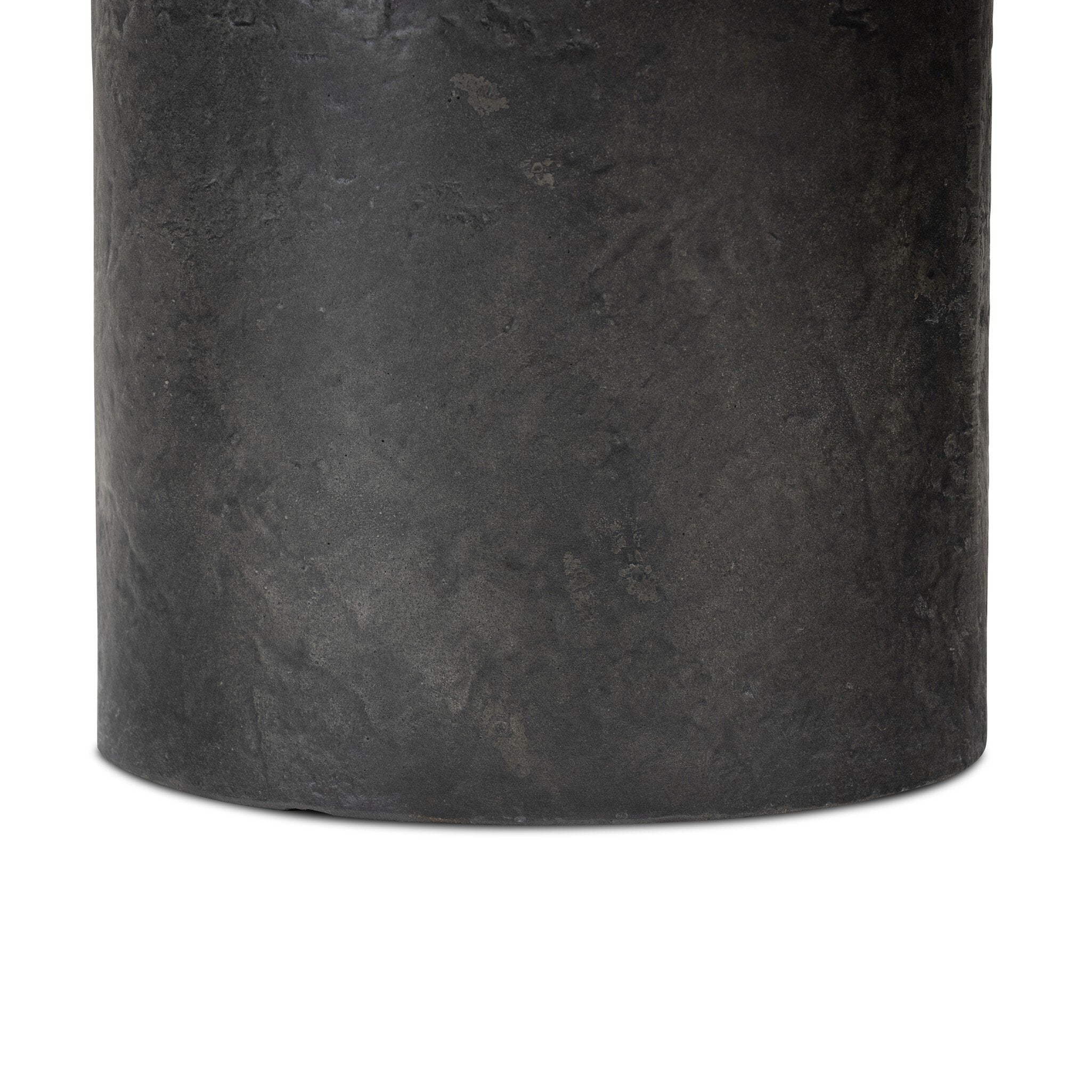 Close-up of a dark gray cylindrical coffee table base on a white background