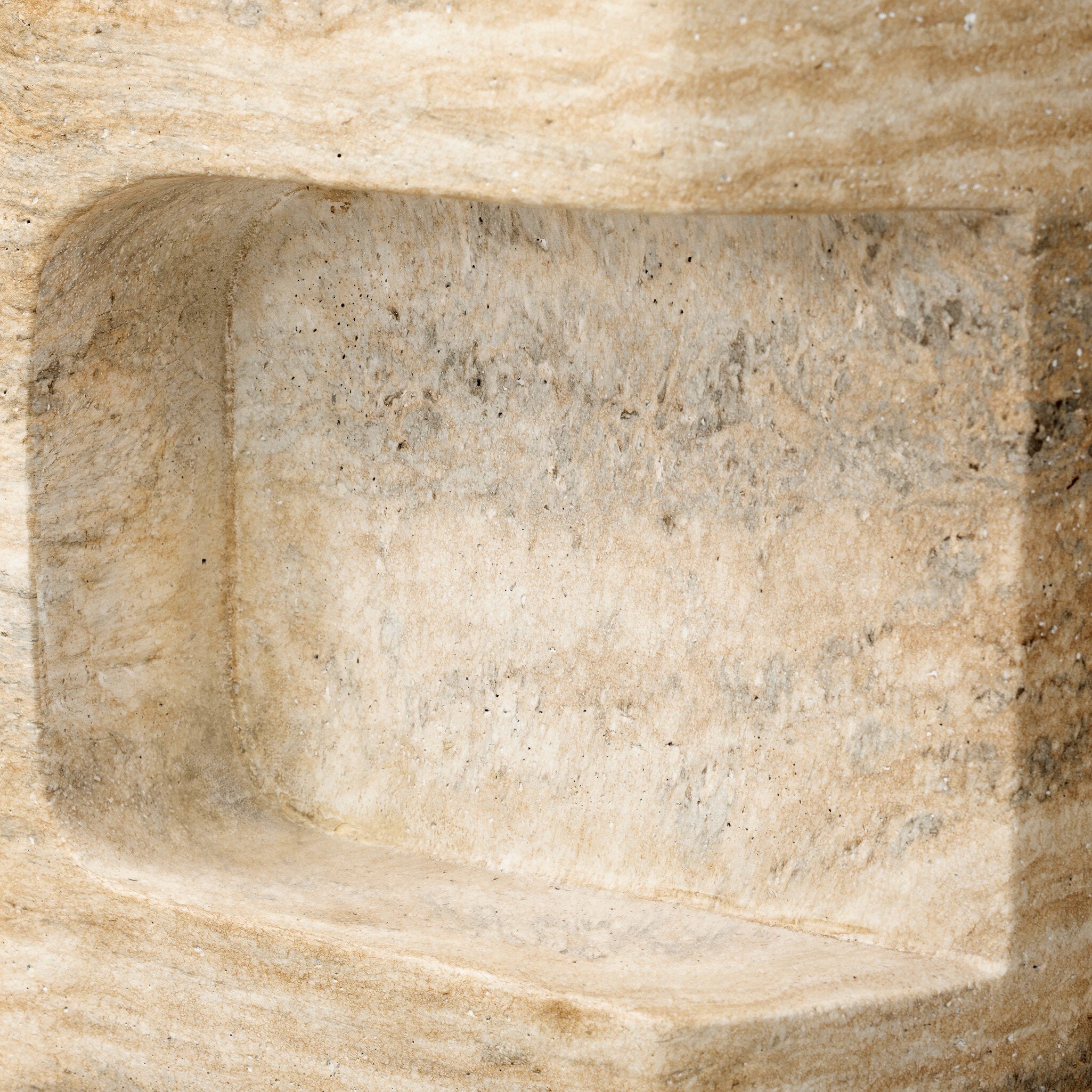 Close-up of a concrete side table with natural texture and color variations
