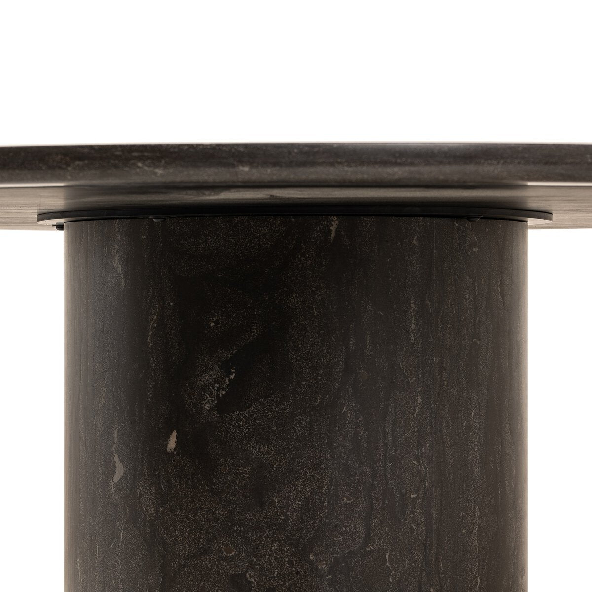 Close-up of a dark marble cylindrical object with a white background