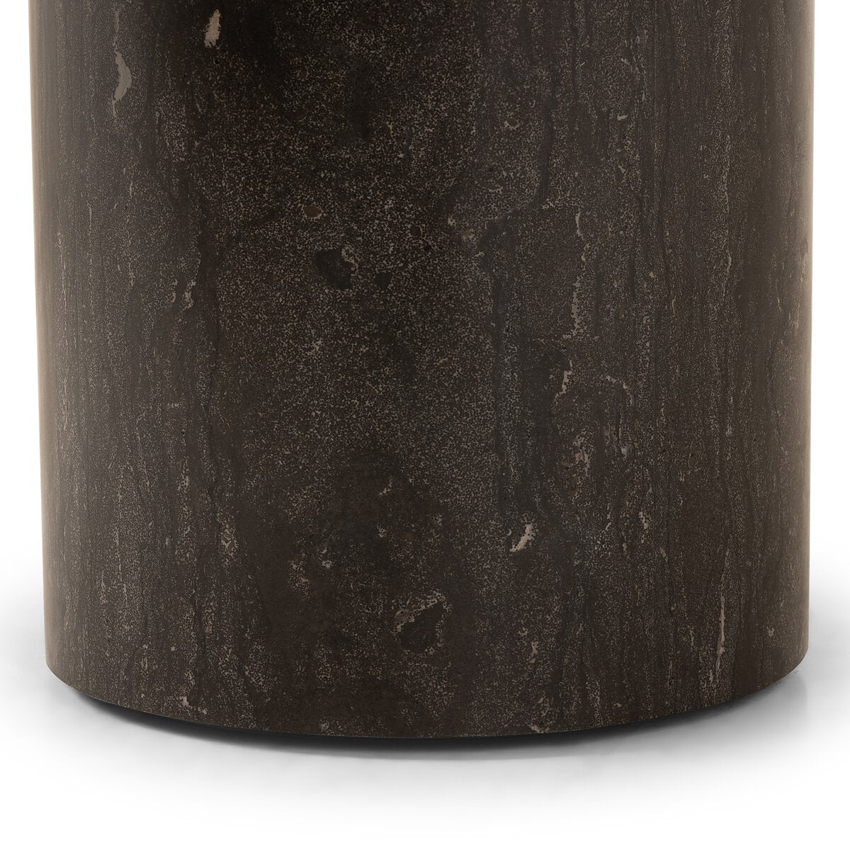 Close-up of a dark brown cylindrical object with textured surface on a white background