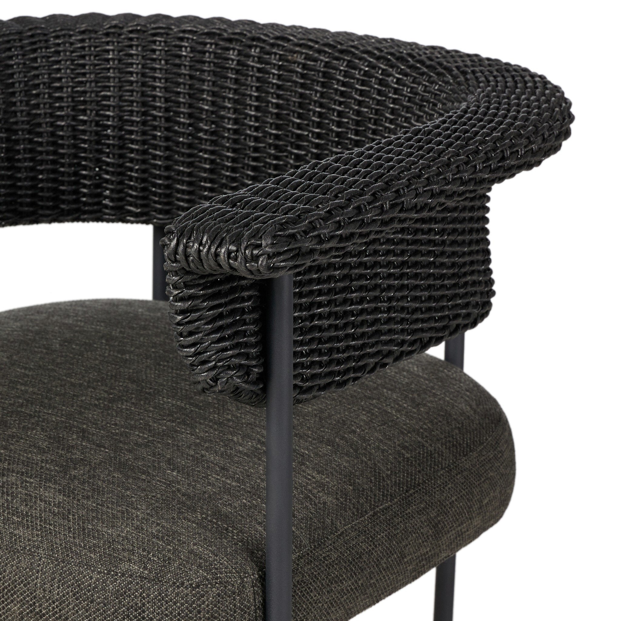 Close-up of a chair with woven backrest and upholstered seat on a white background