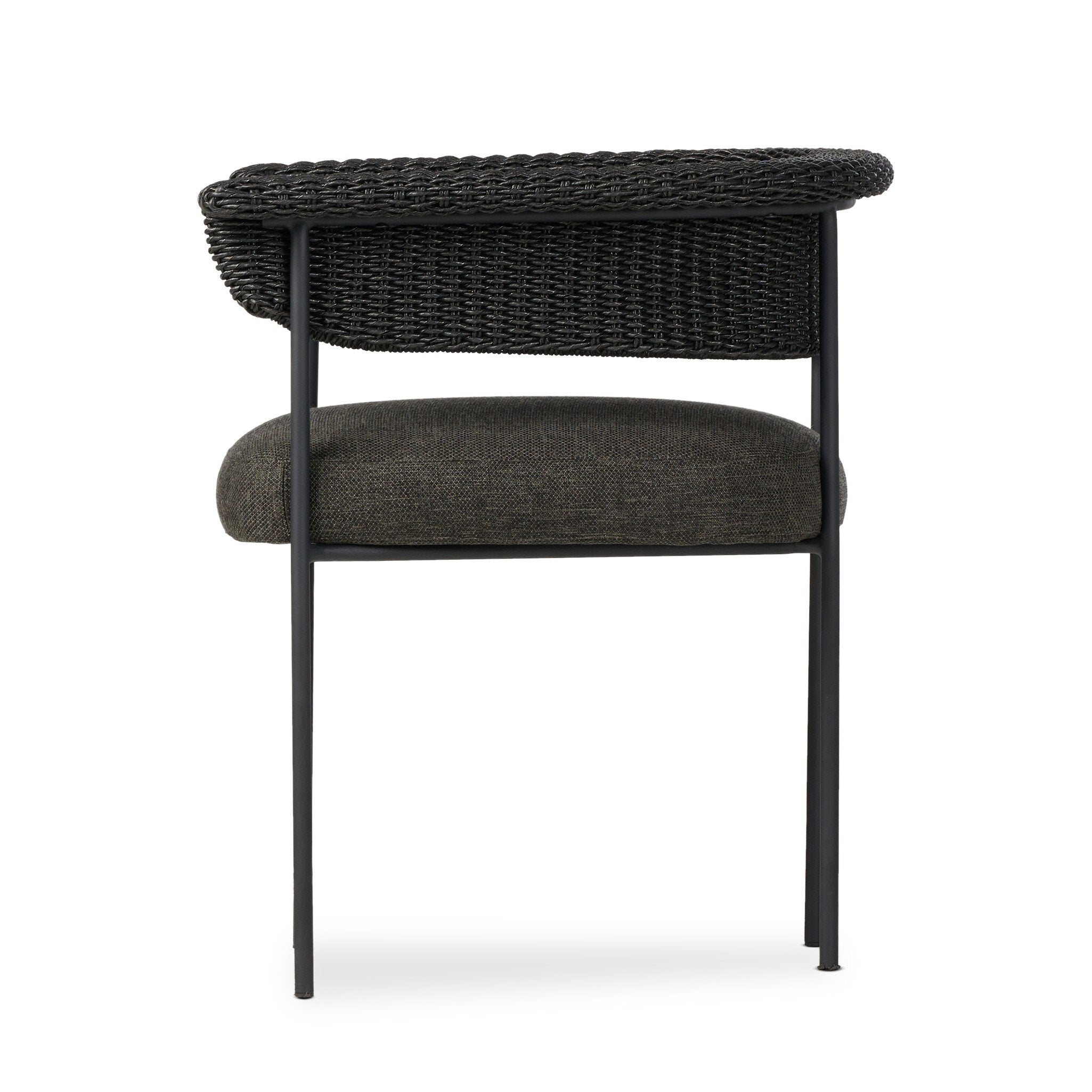 Black wicker chair with dark cushion on a white background