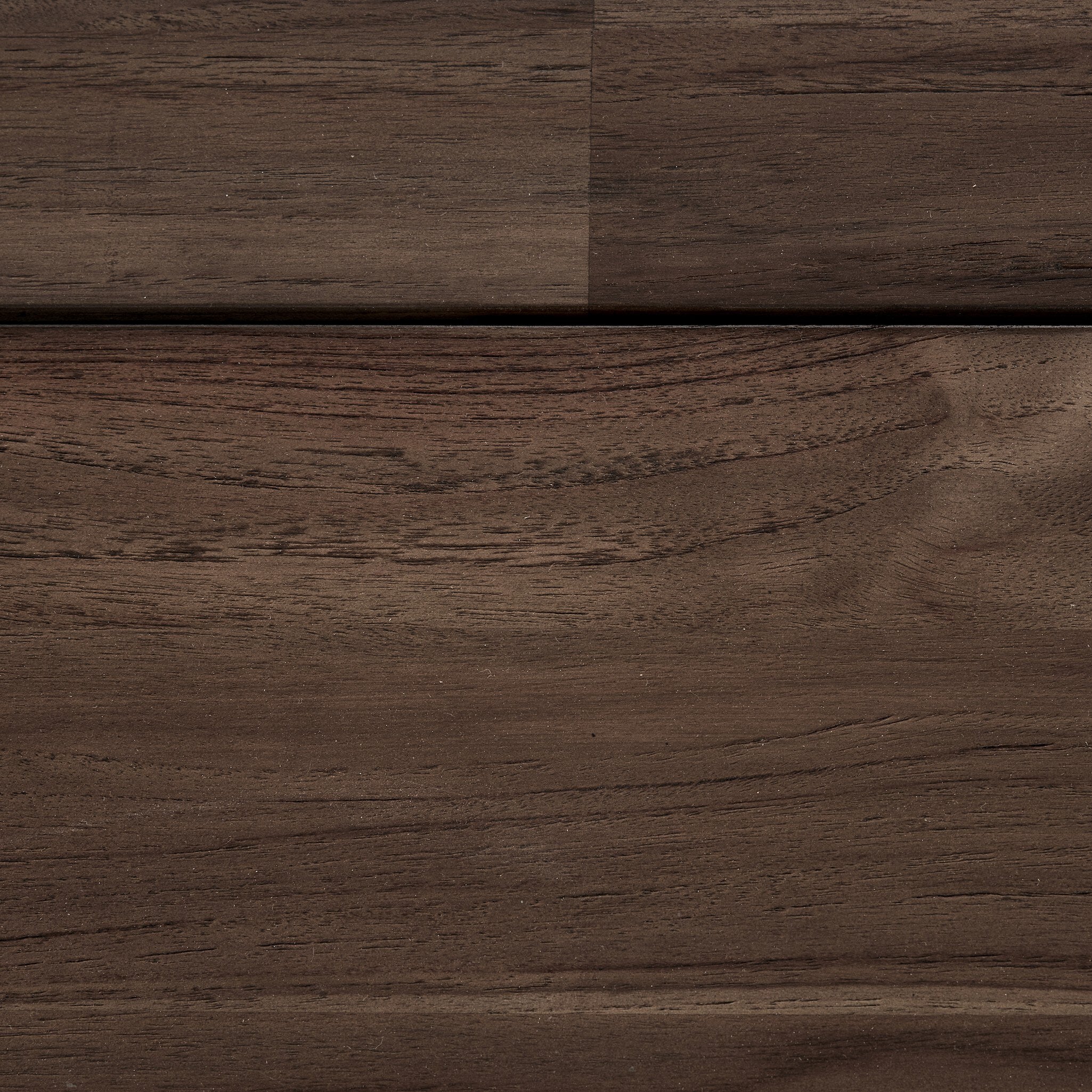 Close-up of dark brown wooden surface with visible grain and texture