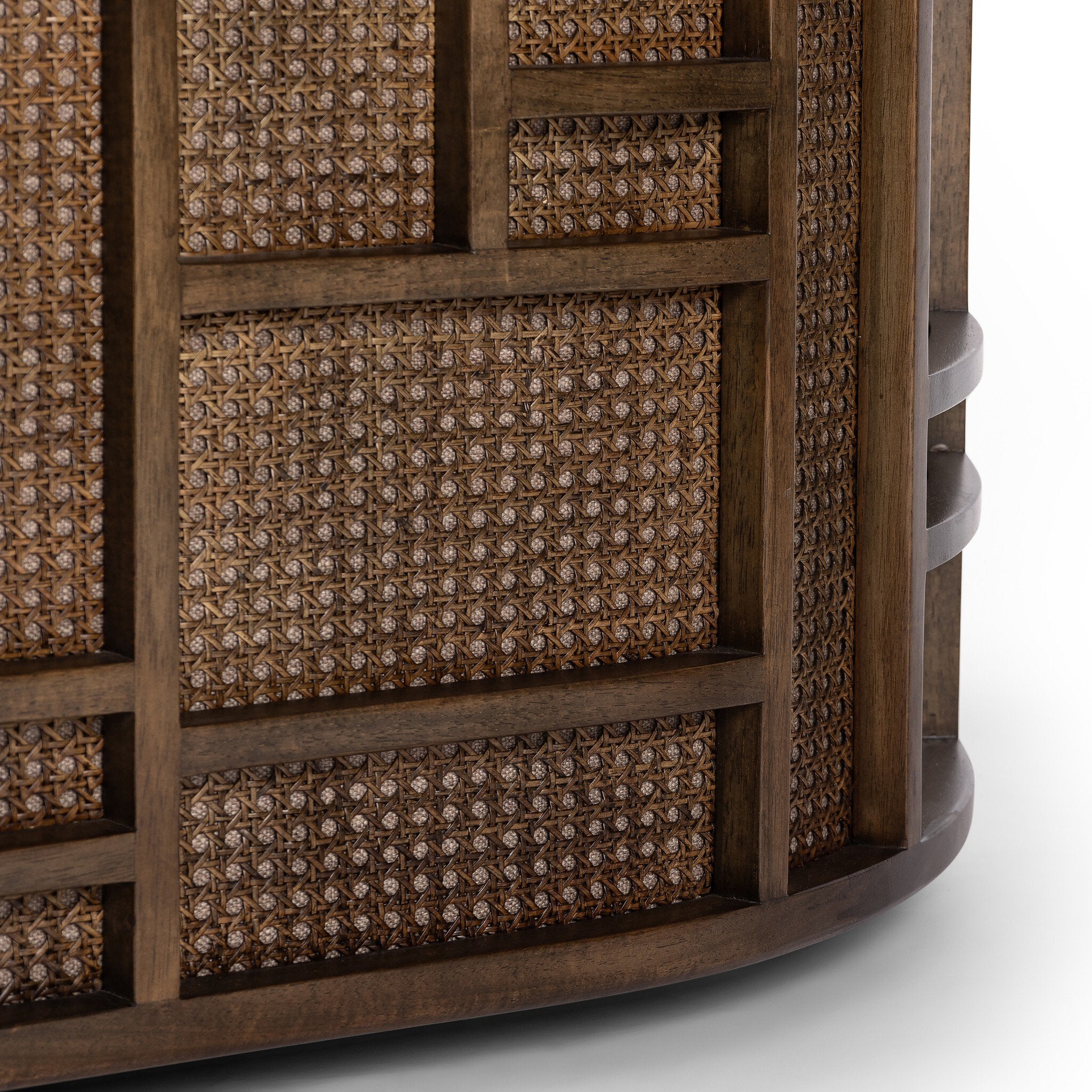 Close-up of a wooden cabinet with woven patterns on a white background