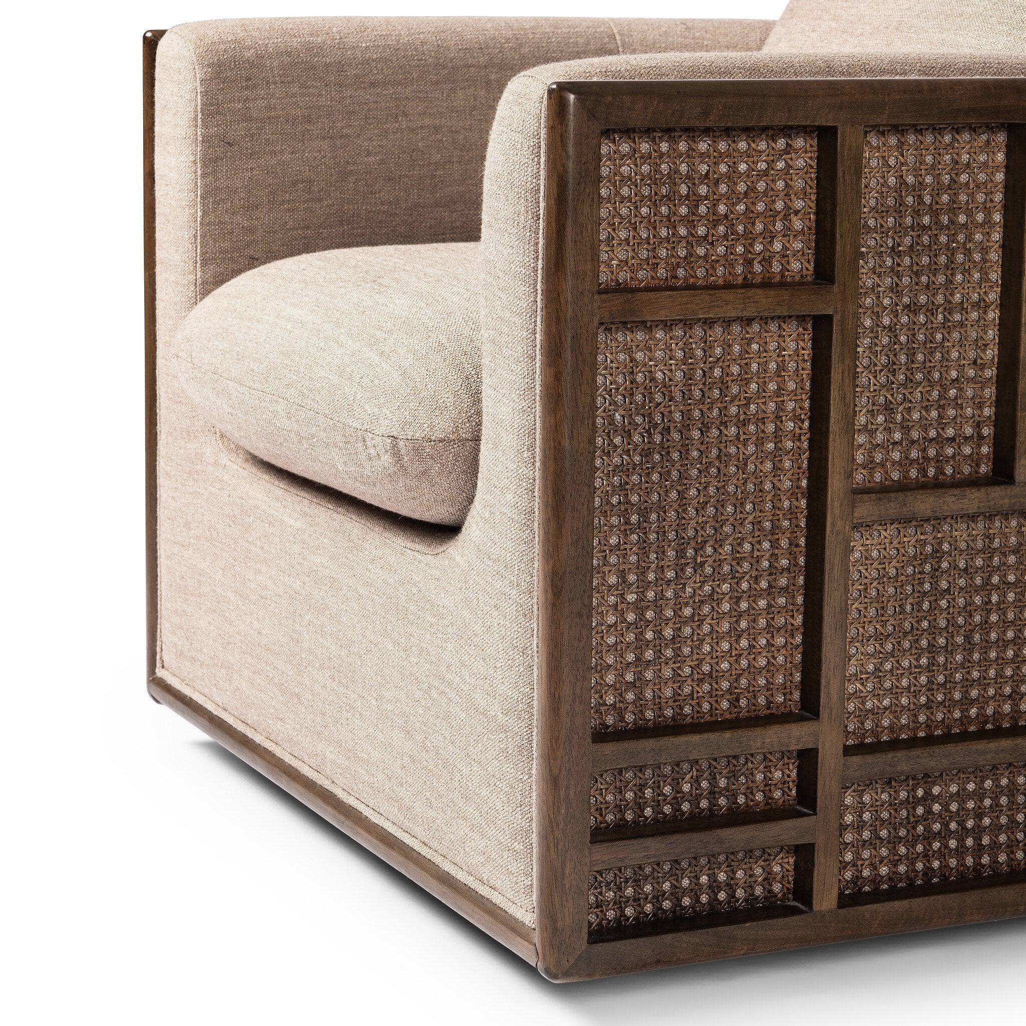 Beige sofa with wicker-patterned backrest on a white background