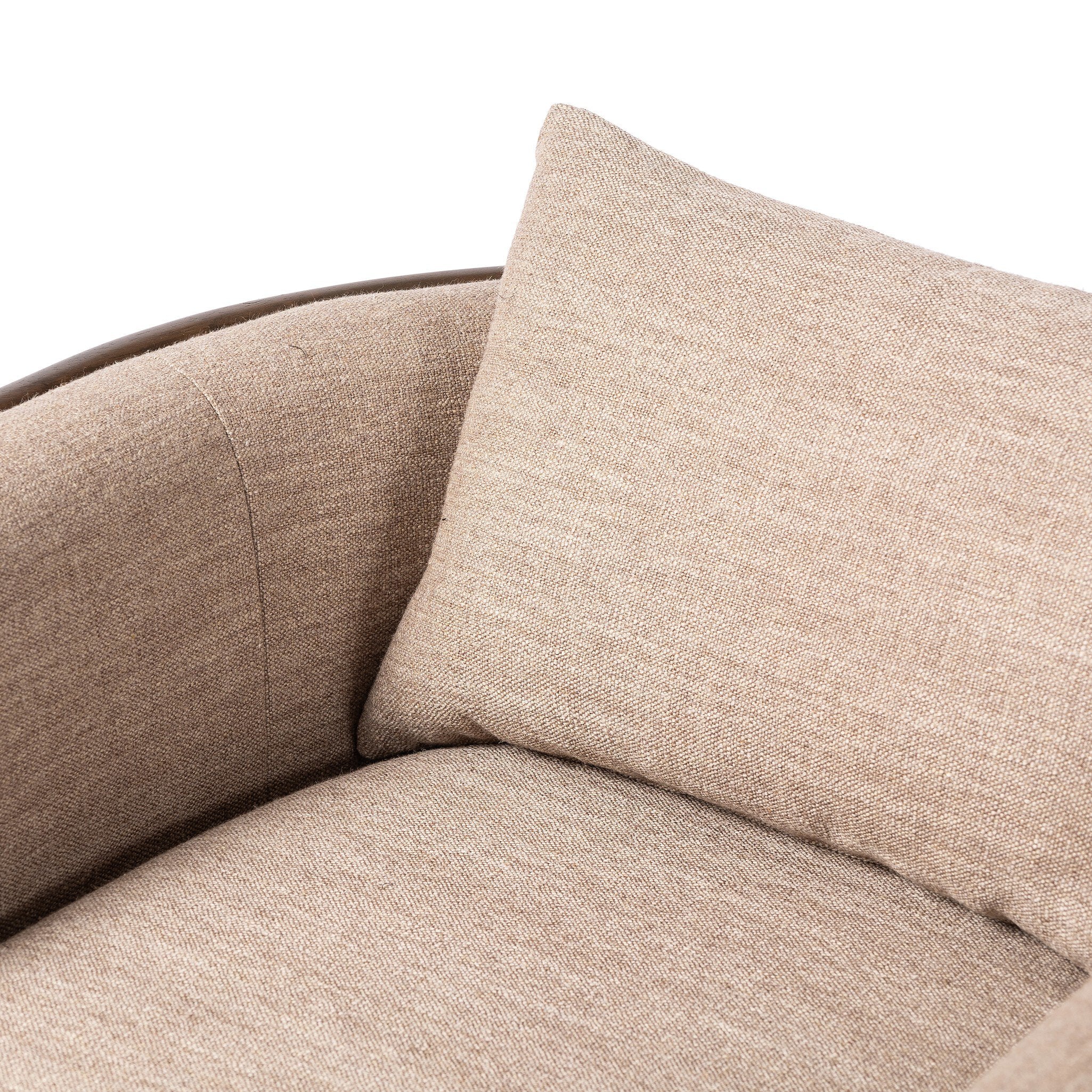 Close-up of a beige textured armchair with a matching pillow on a white background