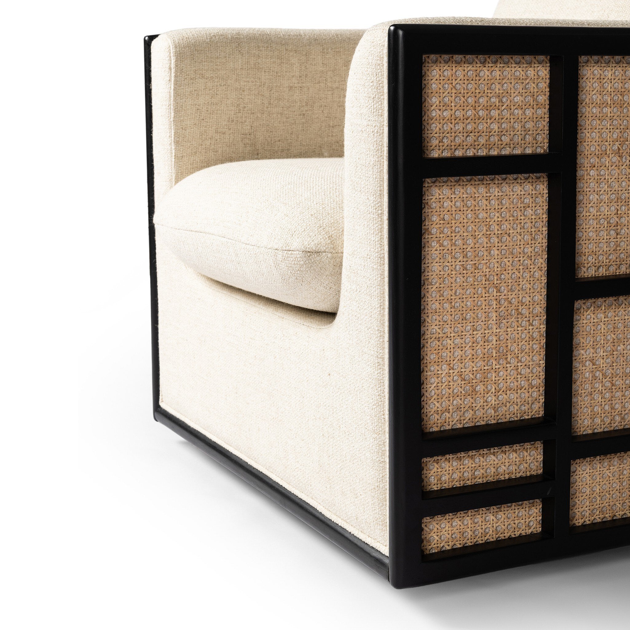 Sofa with beige cushion and black frame on a white background