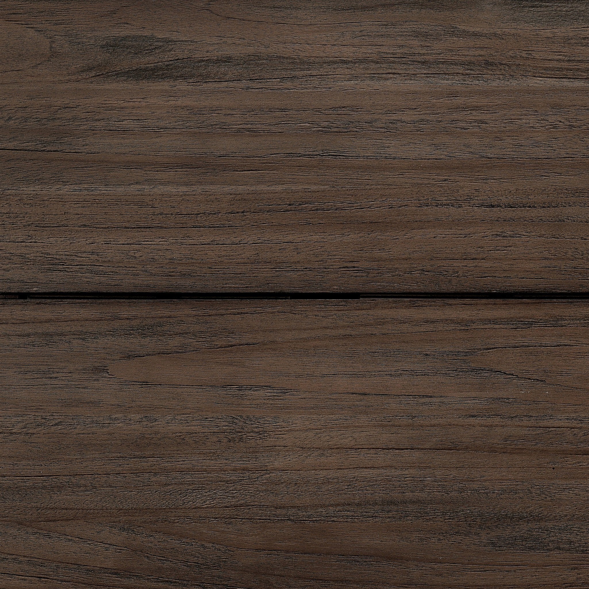 Close-up of a wooden surface with a dark brown color and visible grain.