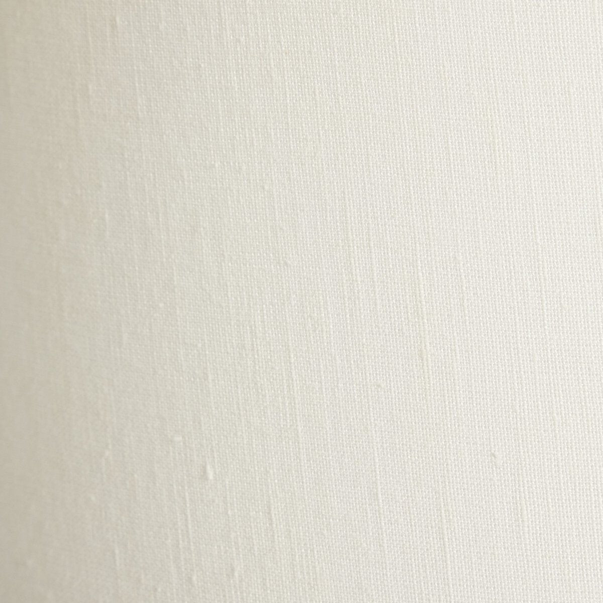 Close-up of a textured white fabric surface