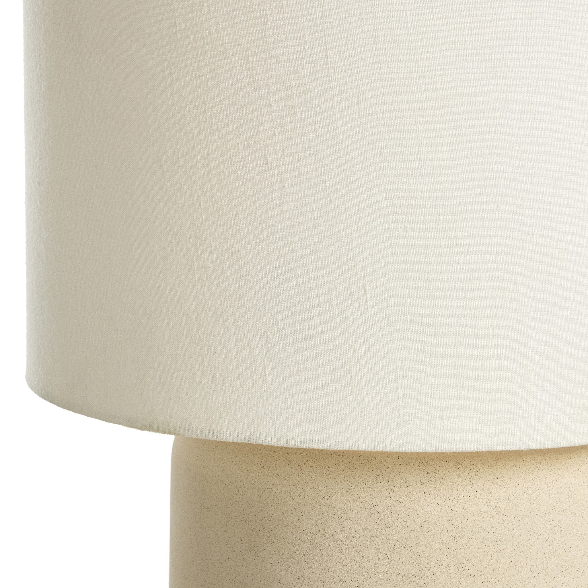 Close-up of a beige lampshade on a white background