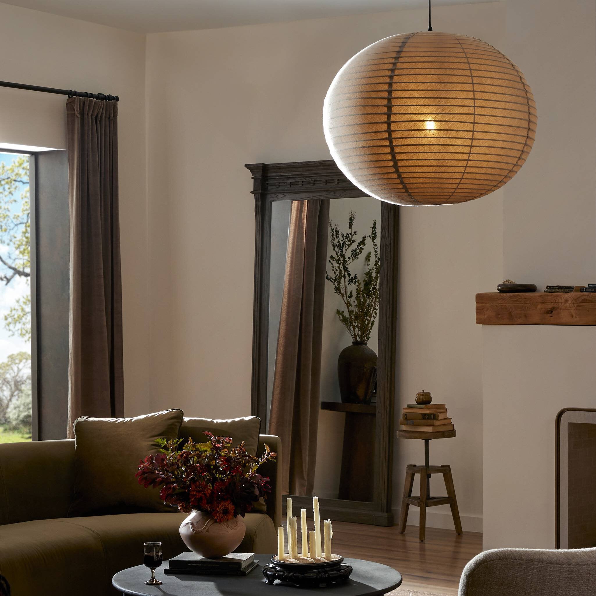 Living room with a couch, coffee table, and decorative items.