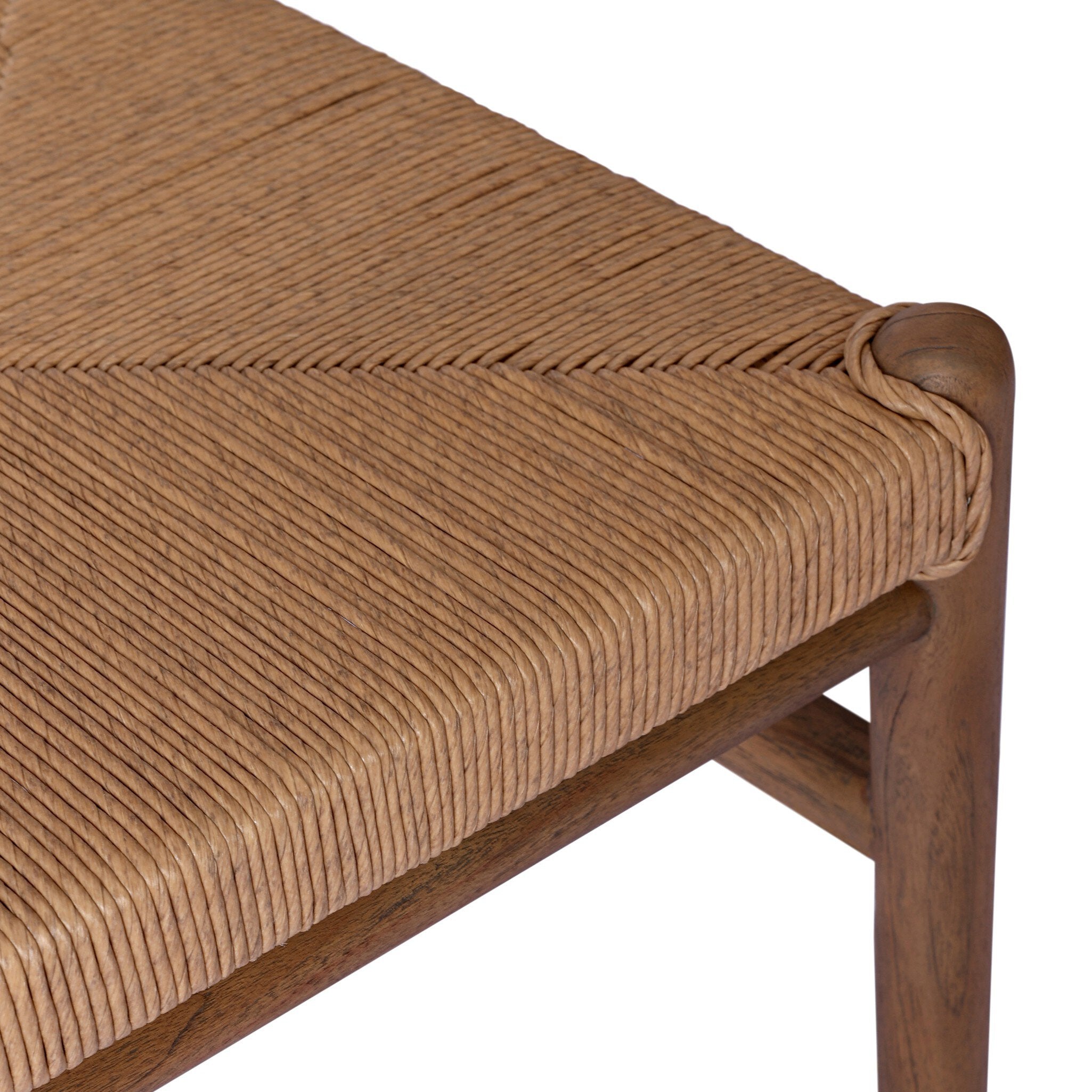 Close-up of a wooden chair with a woven seat on a white background