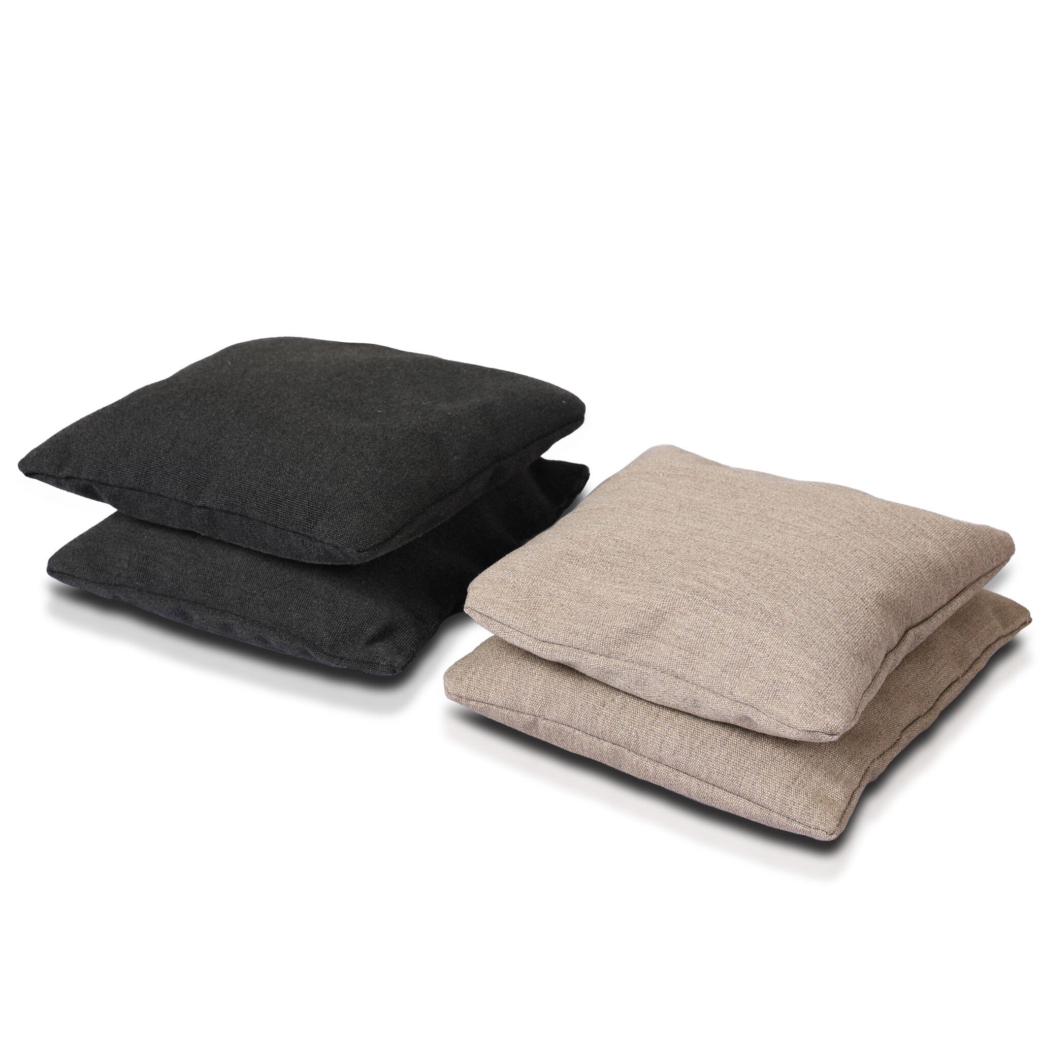Two black cushions and two beige cushions on a white background