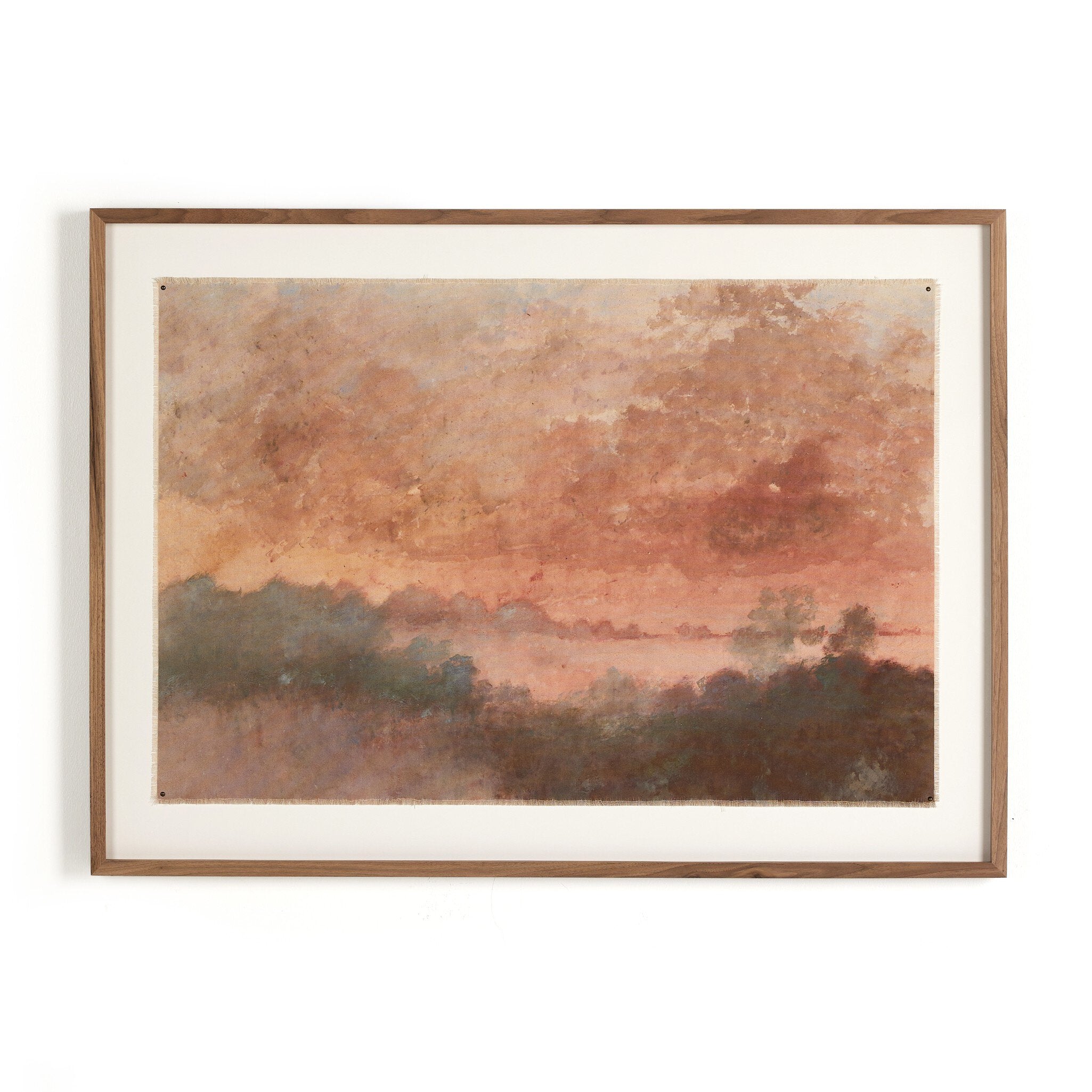 Framed artwork with a landscape scene featuring a sunset or sunrise over water.