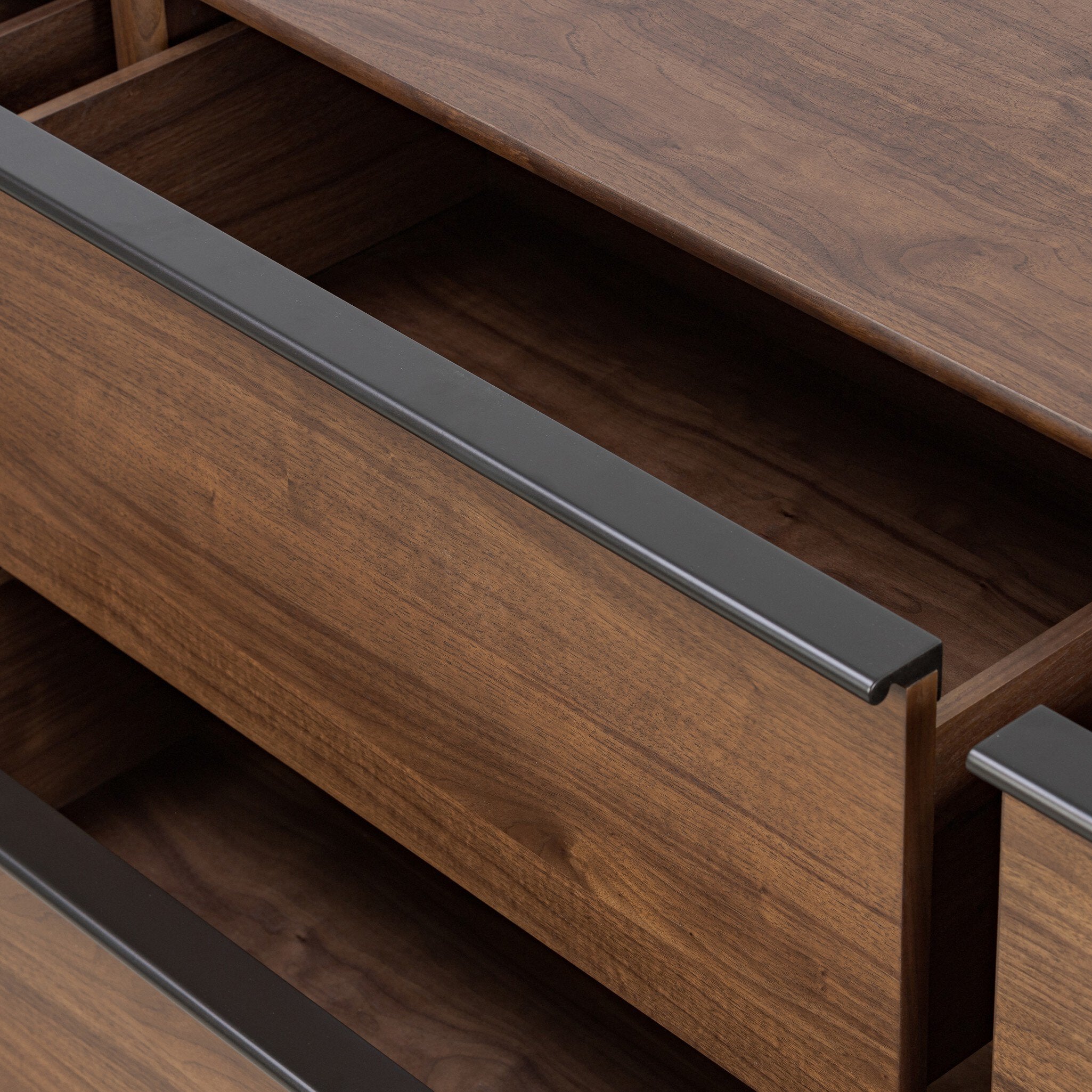 Wooden drawer with metal handle on a wooden furniture piece