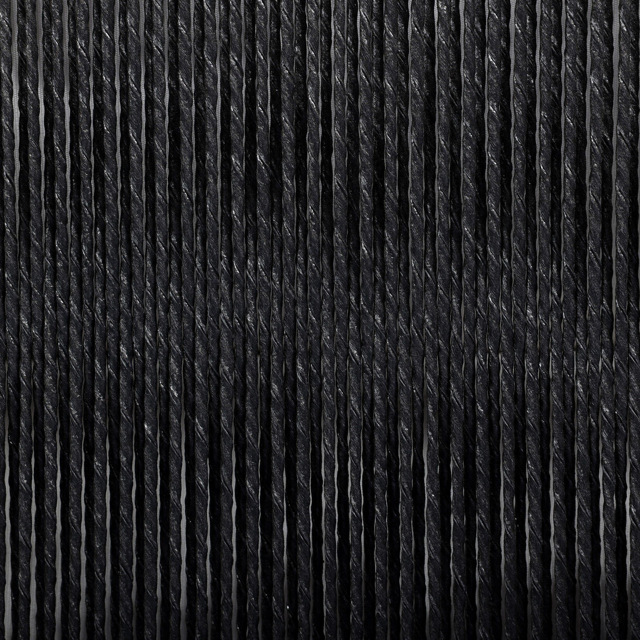 Close-up of black textured fabric with a ribbed pattern