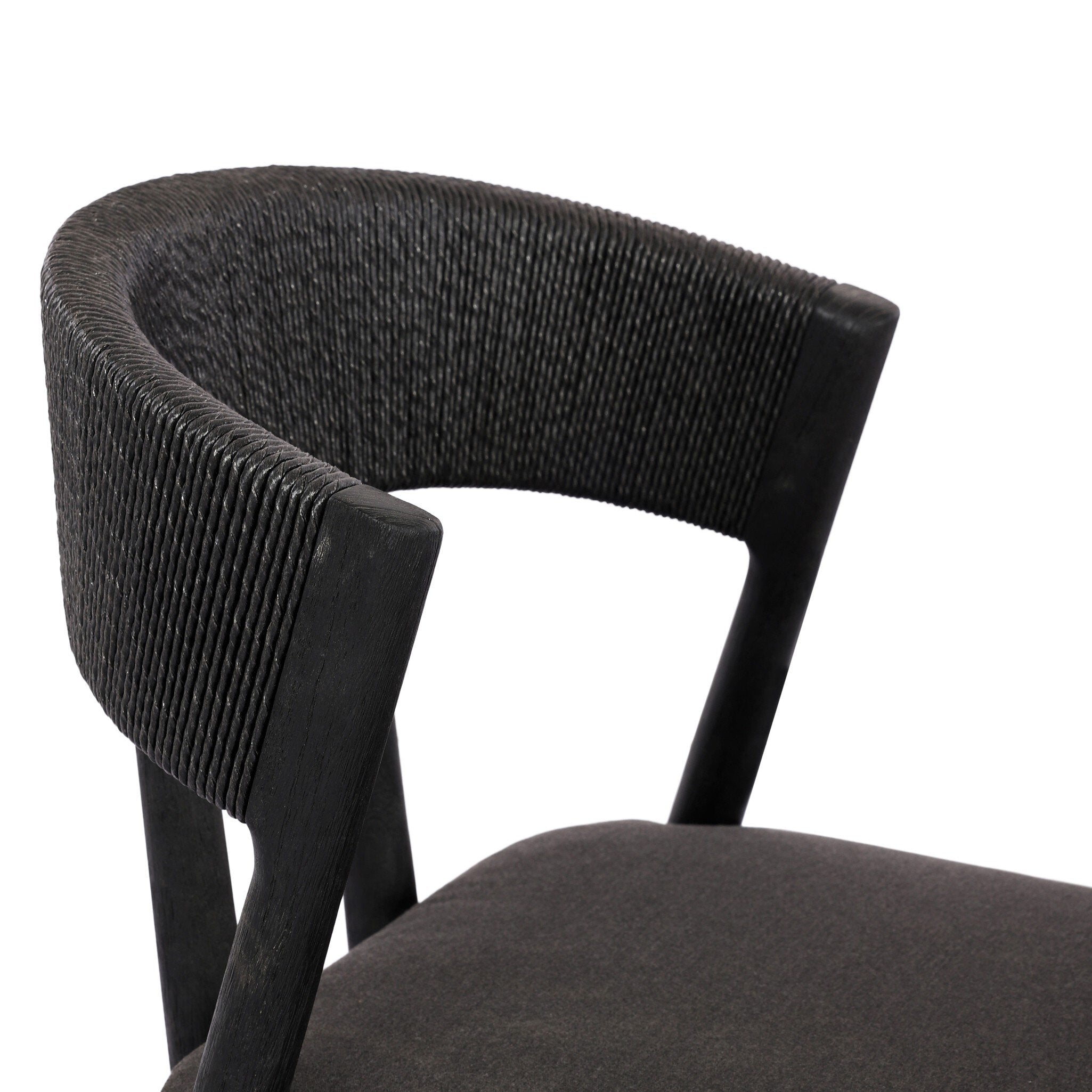 Dark gray upholstered chair with twisted wooden legs on a white background