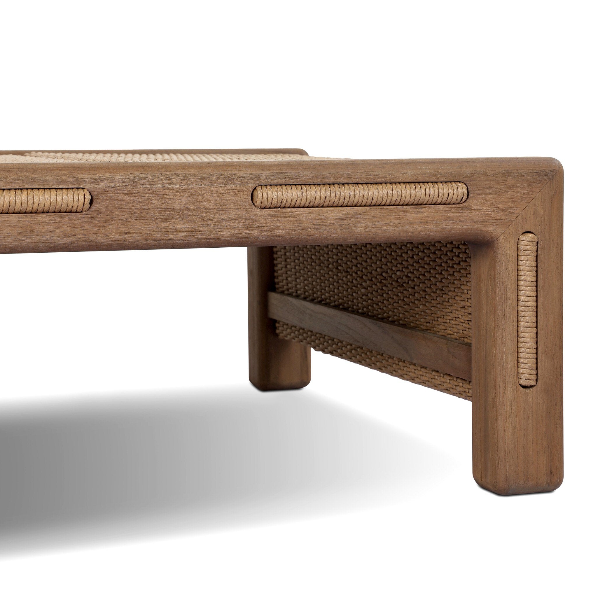 Wooden bench with woven design on a white background