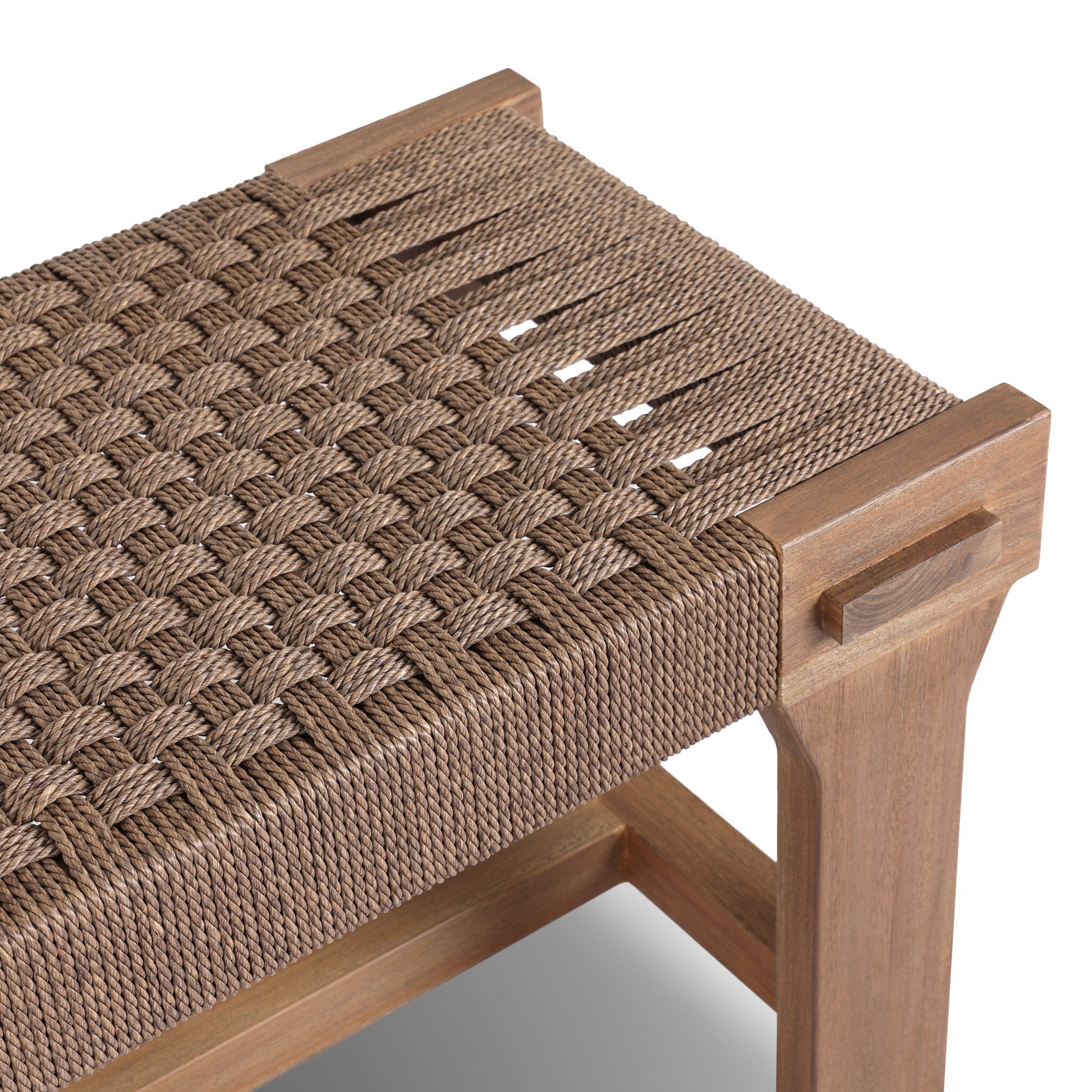 Wooden bench with woven seat on a white background