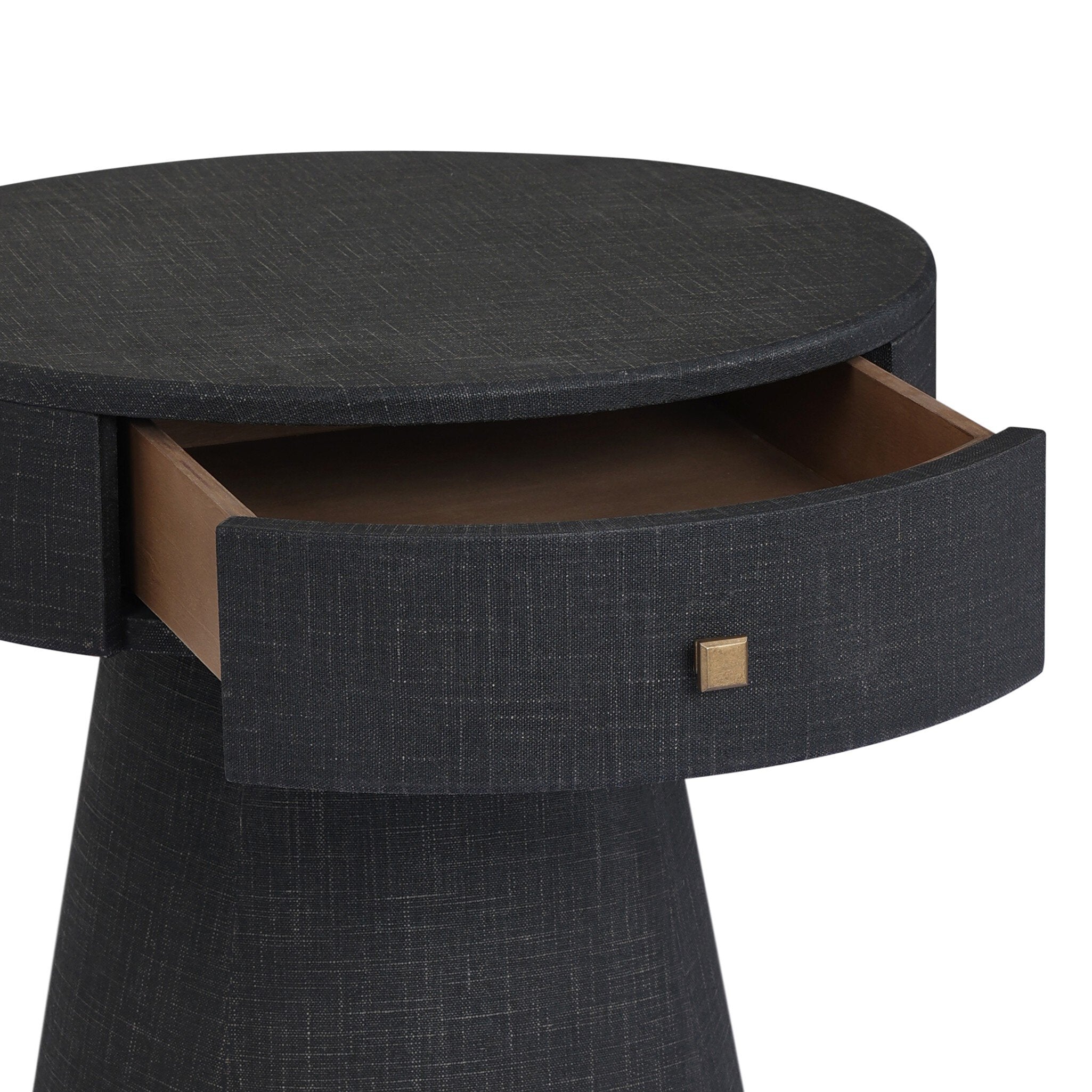 Round black side table with a drawer on a white background