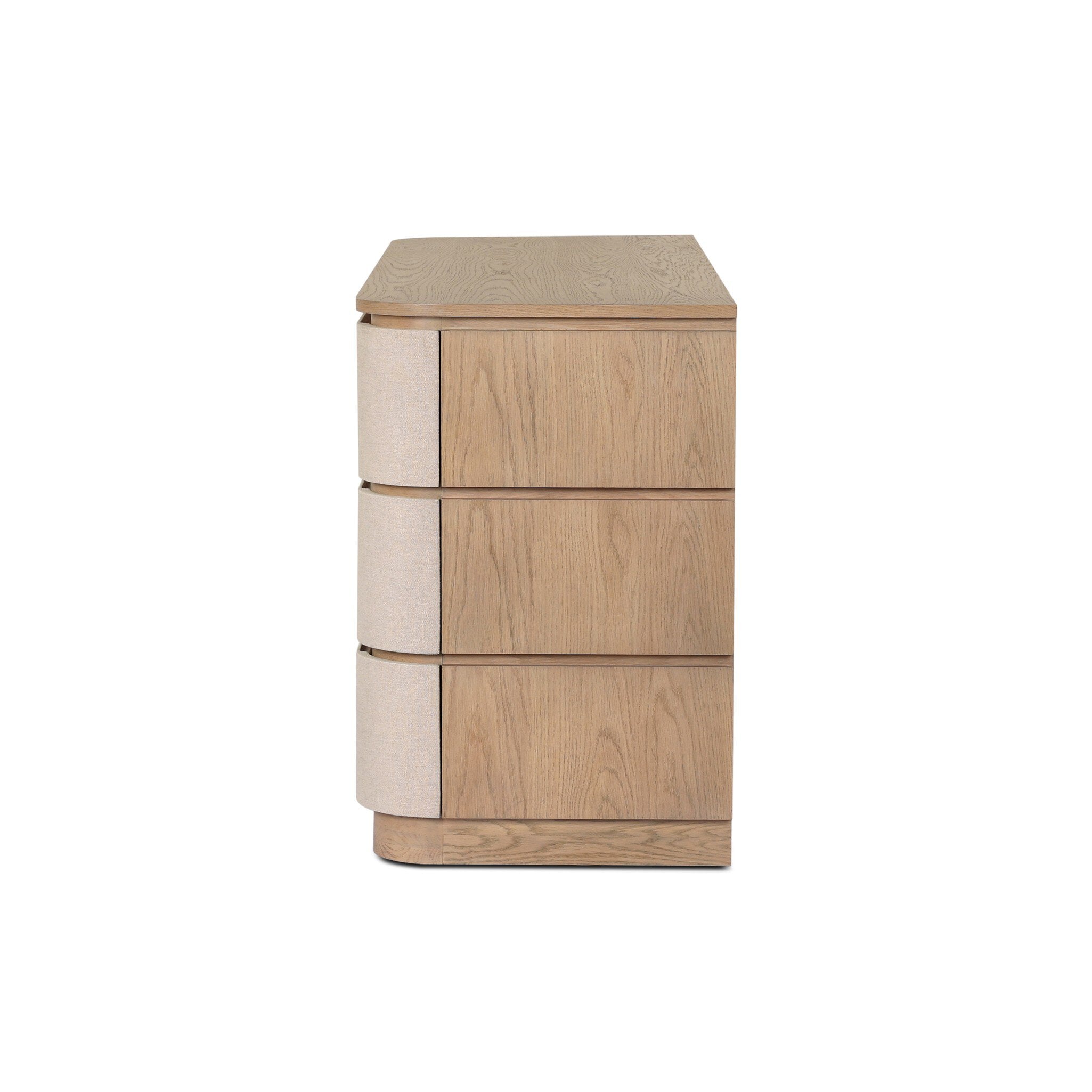 Side view of a beige and wood dresser
