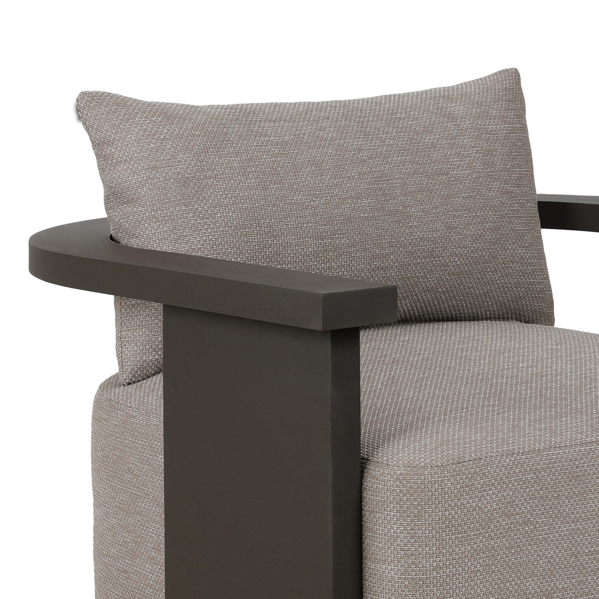 Gray cushioned chair with a dark metal armrest on a white background