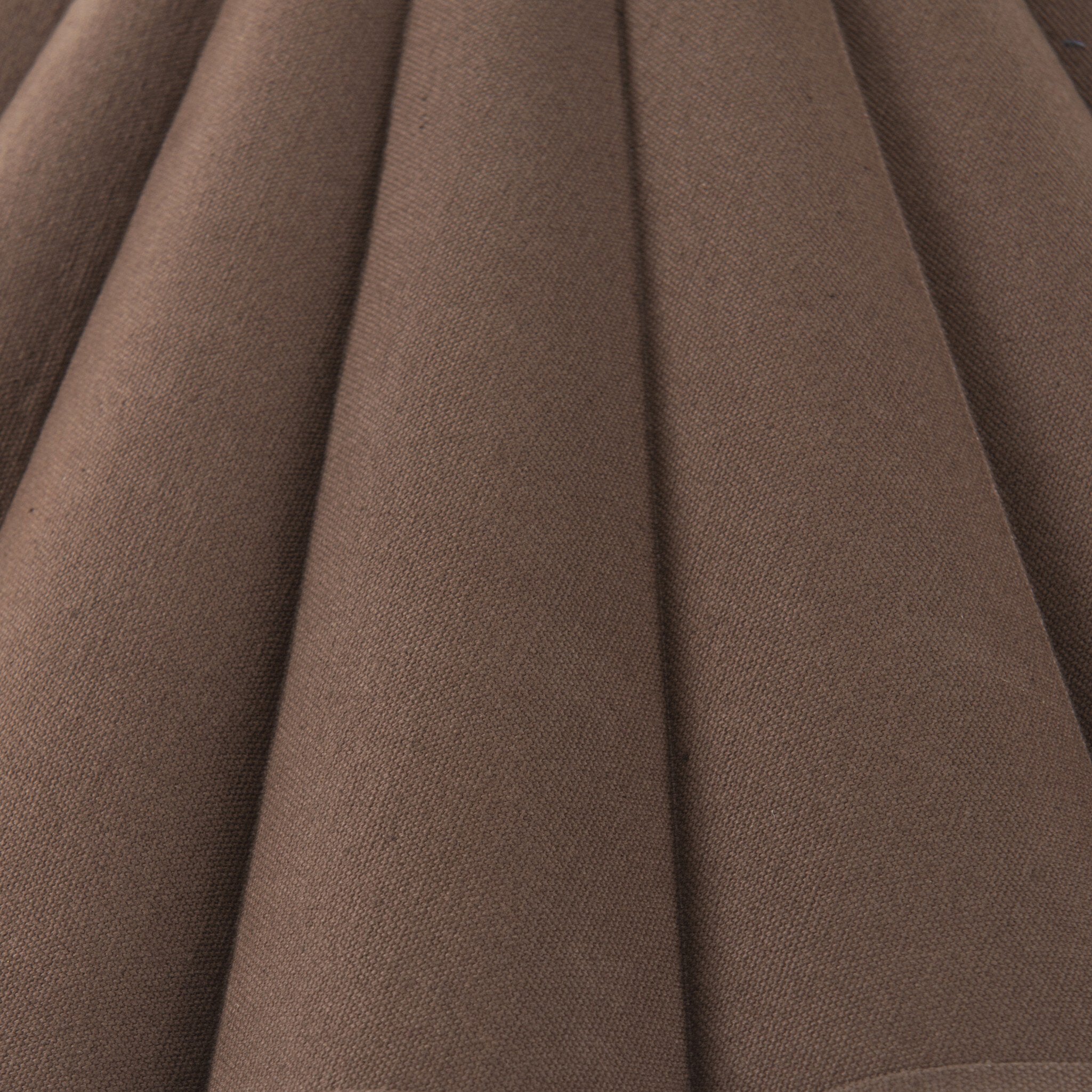 Close-up of brown fabric lampshade with folds