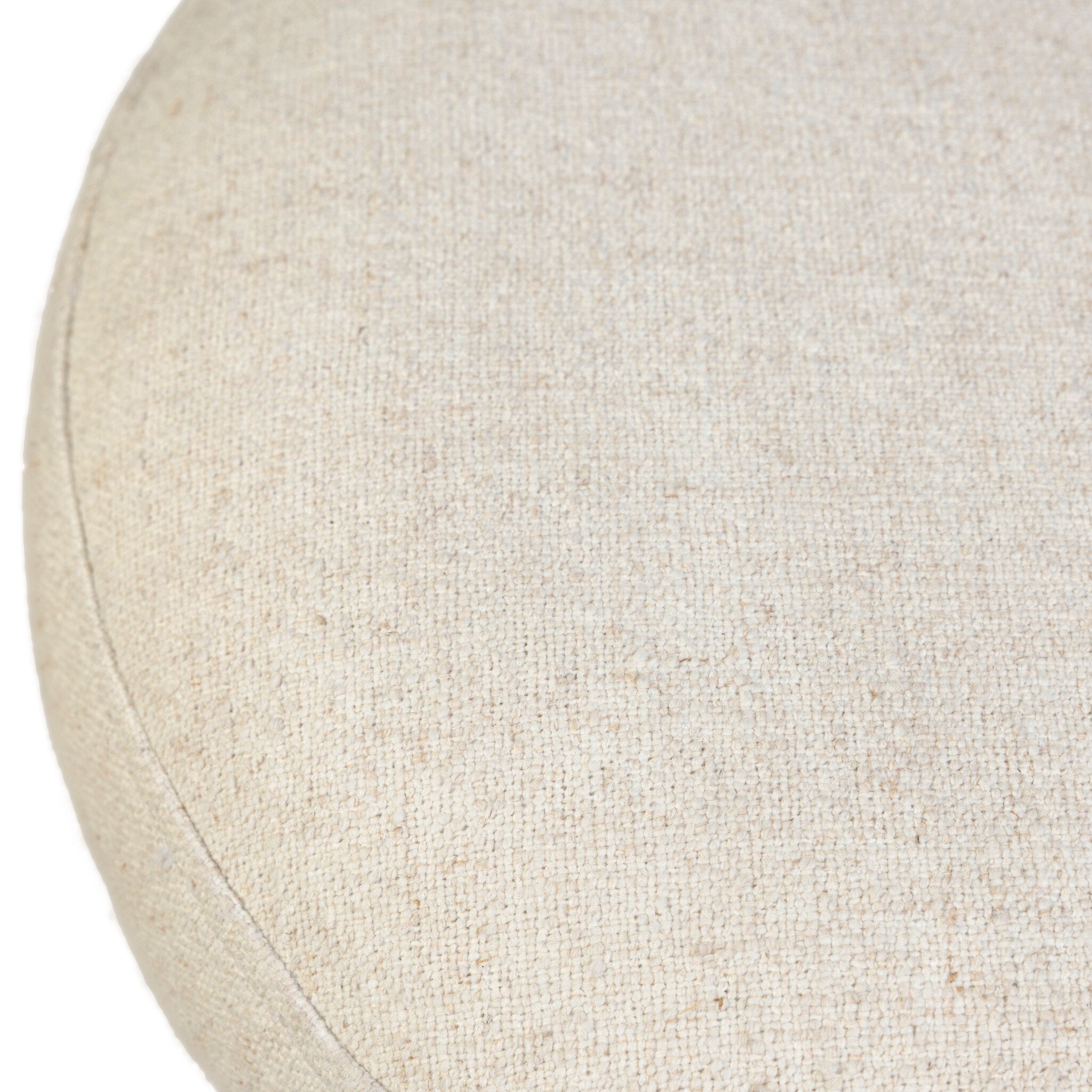 Close-up of a stool seat upholstered in beige fabric 