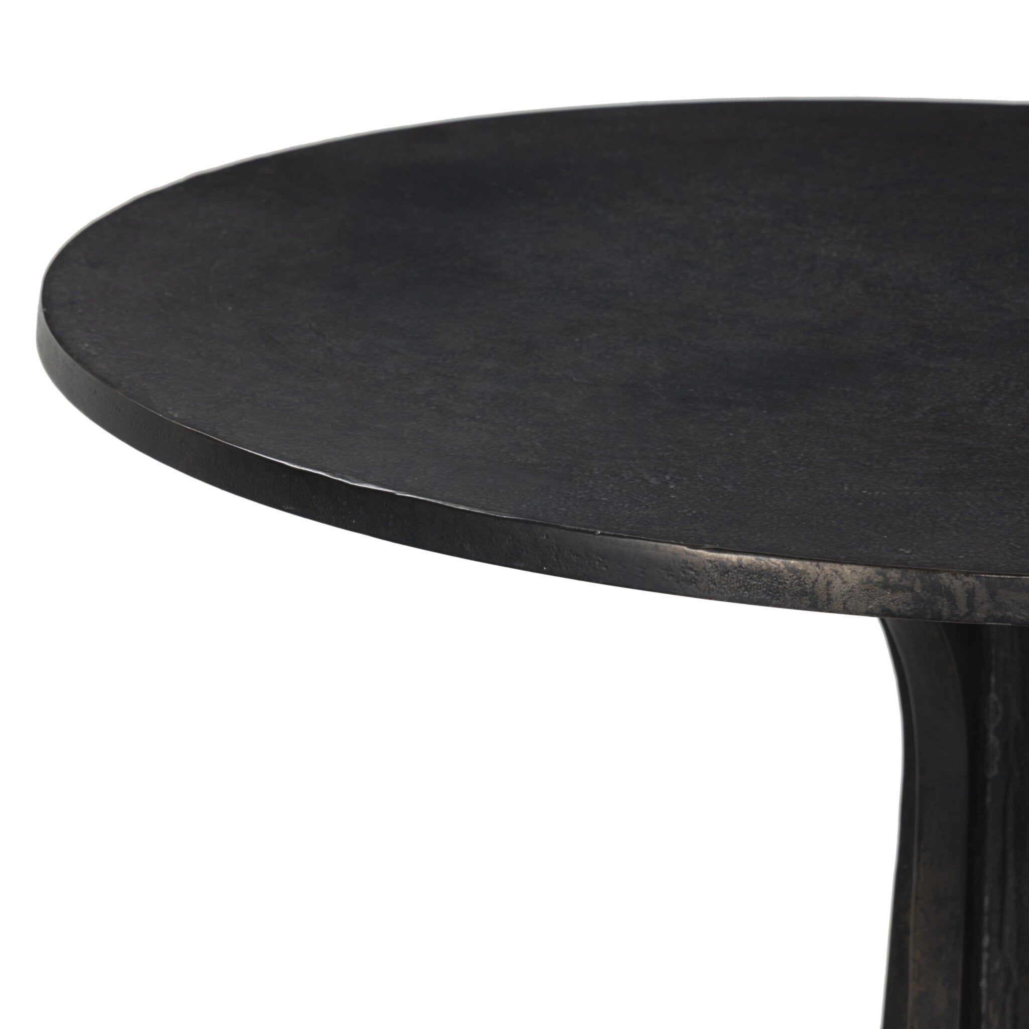 Close-up of a black round table on a white background