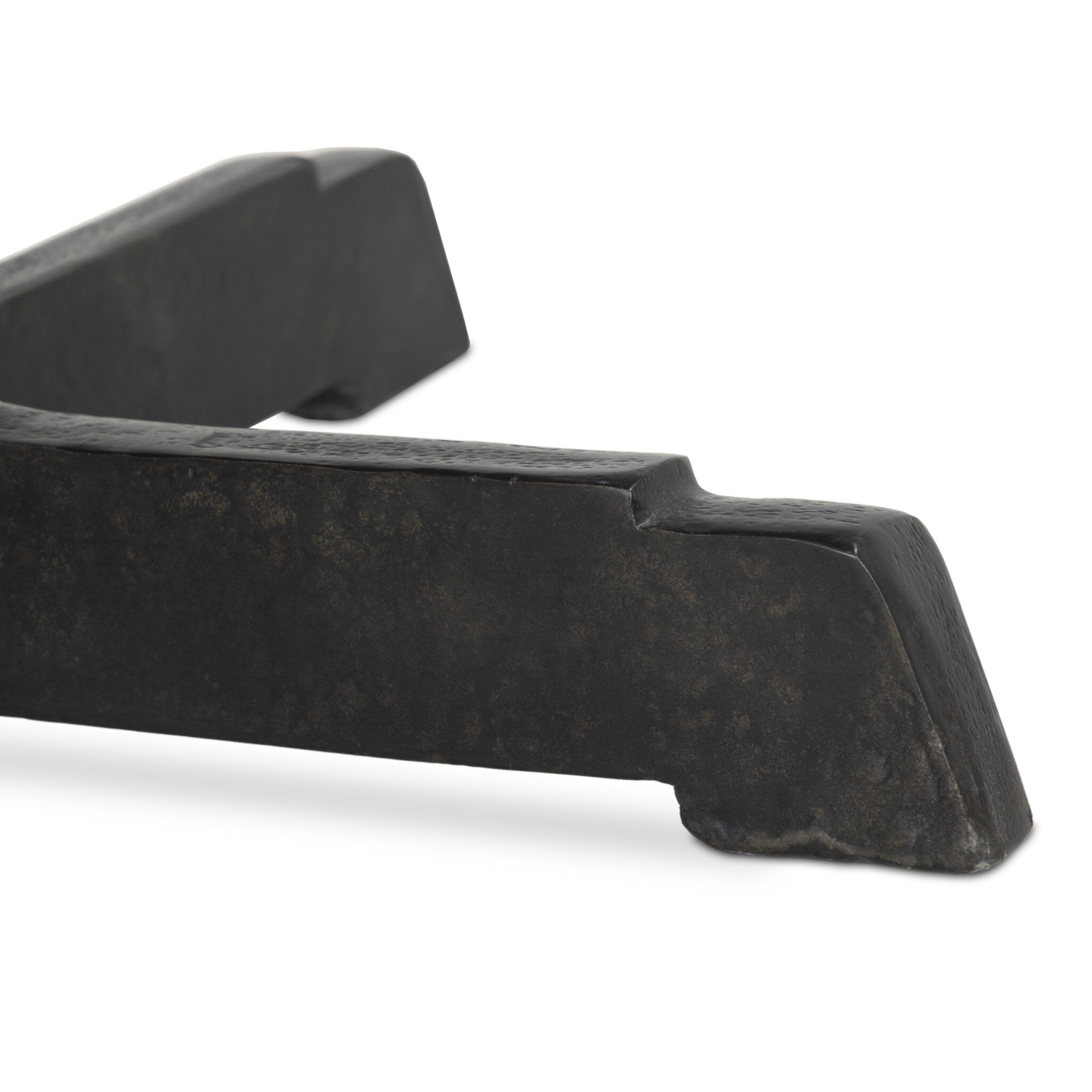 Black metal table foot on a white background