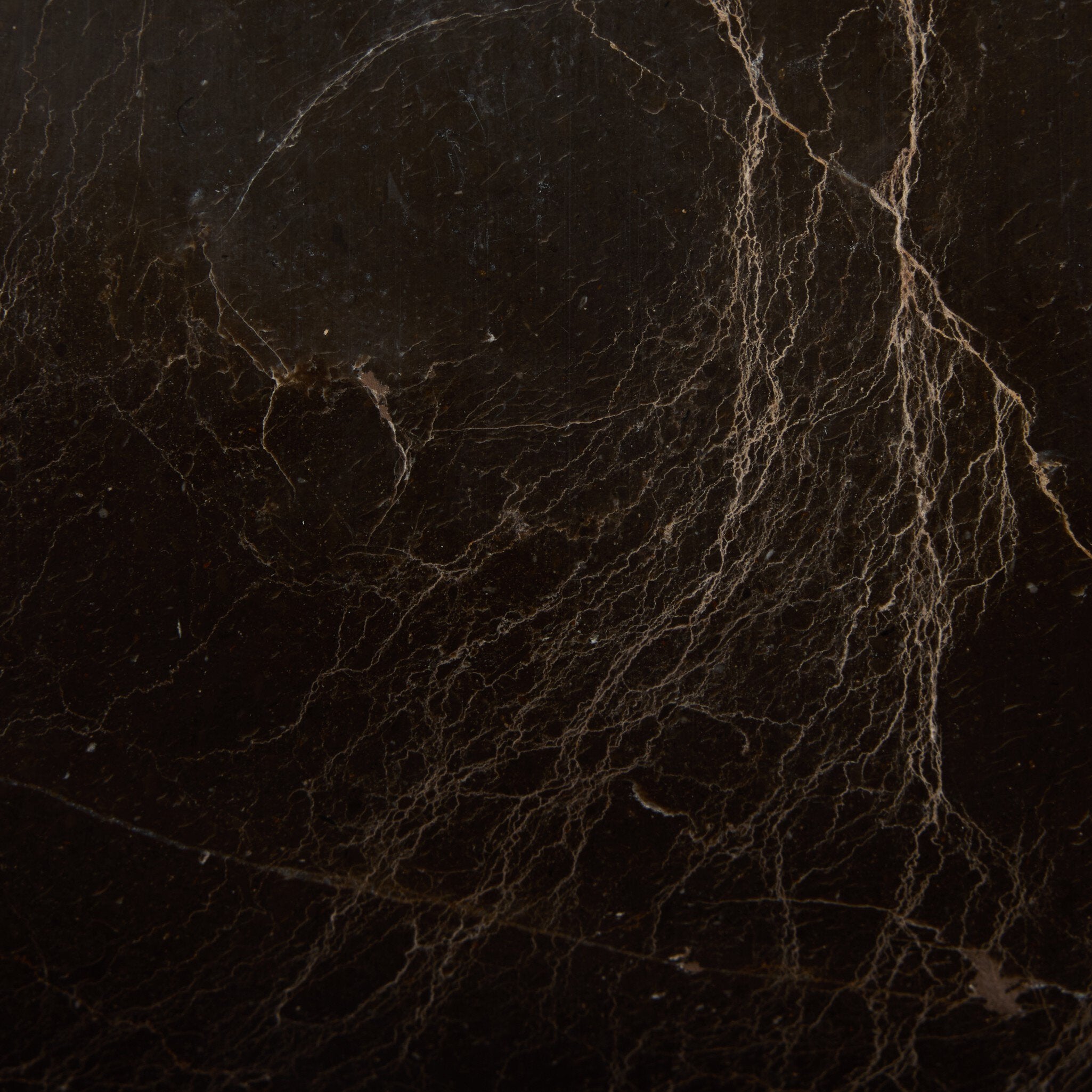 Close-up of a dark brown marble texture